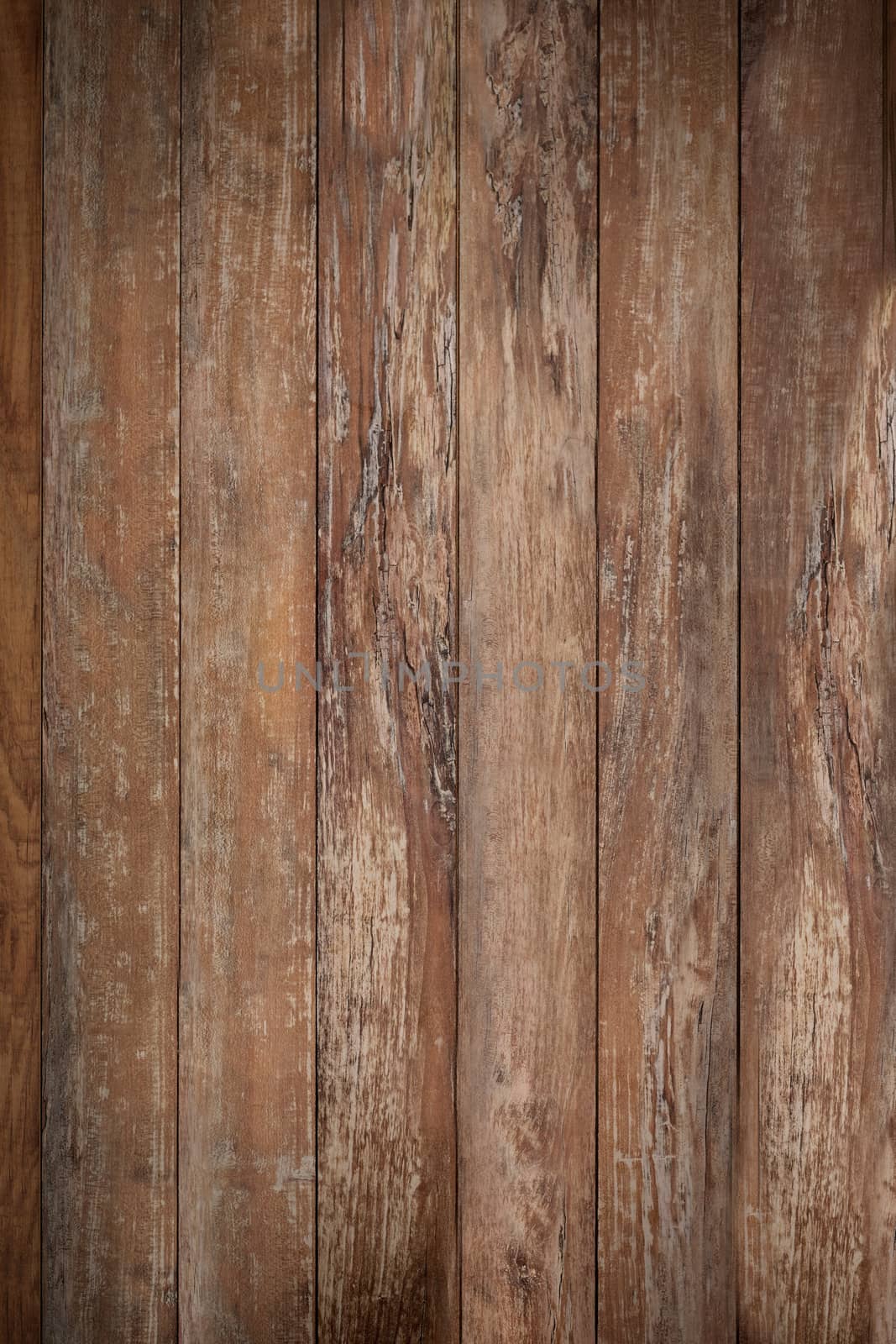 Wooden boards, aged by time, are brown in color .Texture or background