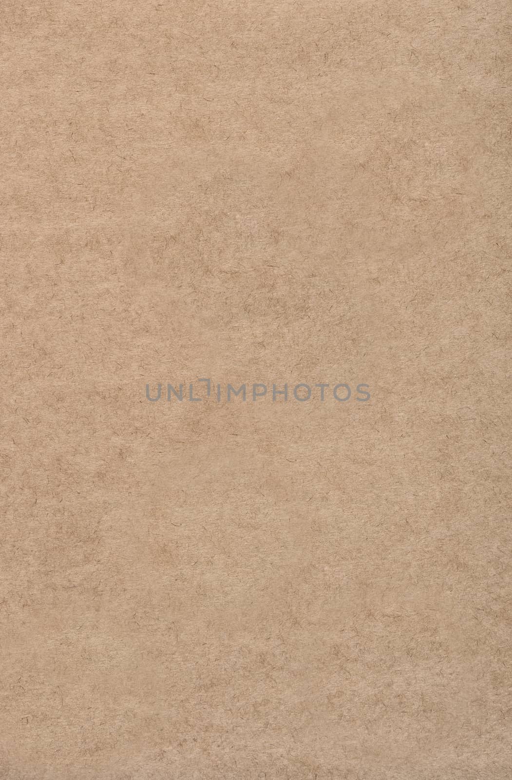 Thin paper base of light brown color. Background or texture