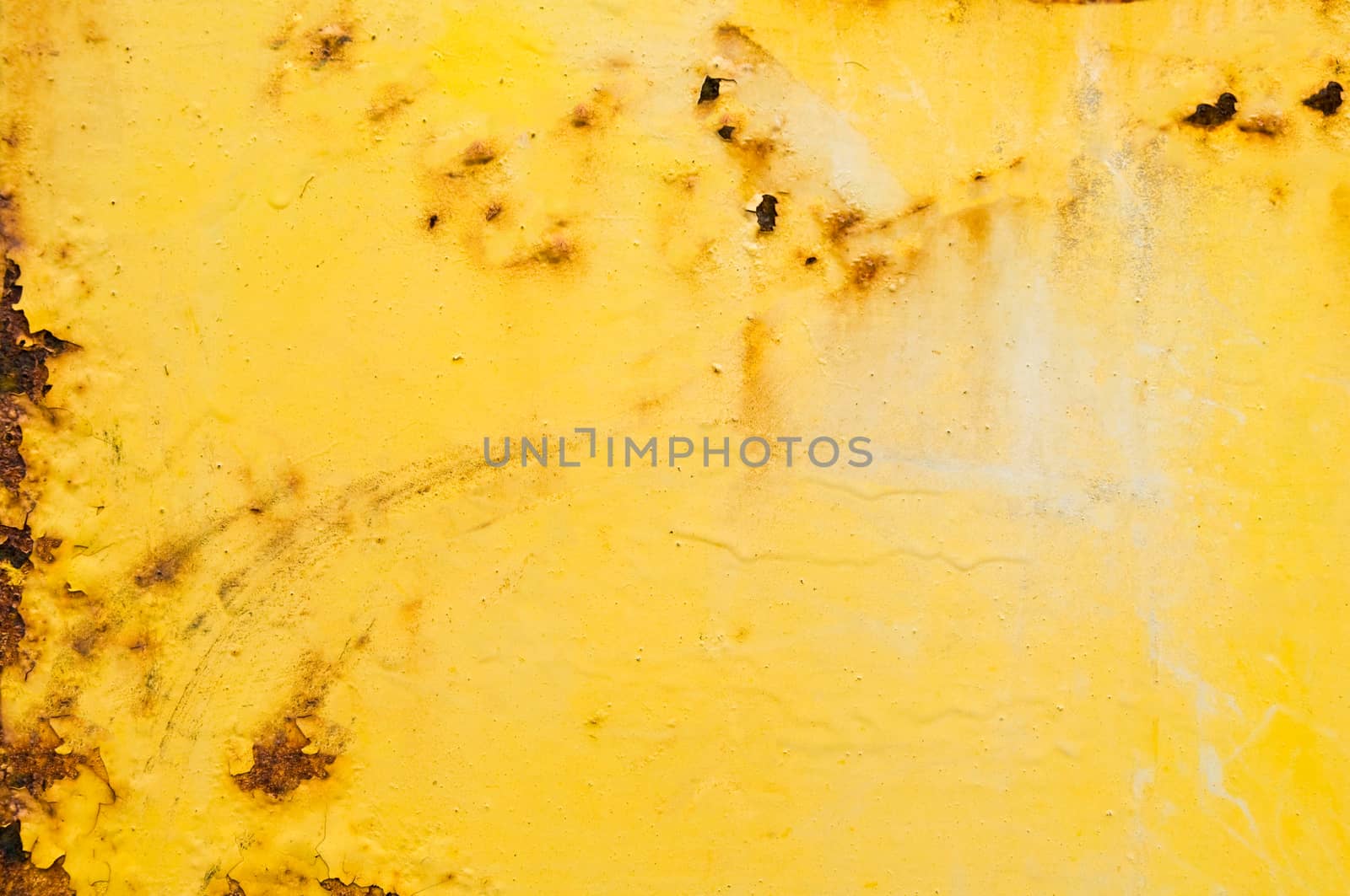 Rusty metal surface with peeling yellow paint.Background.Texture