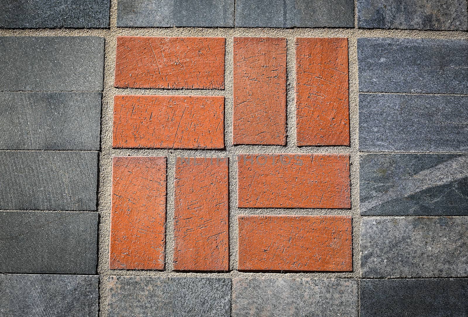 Pattern of red natural stone on the road .Texture.Background.