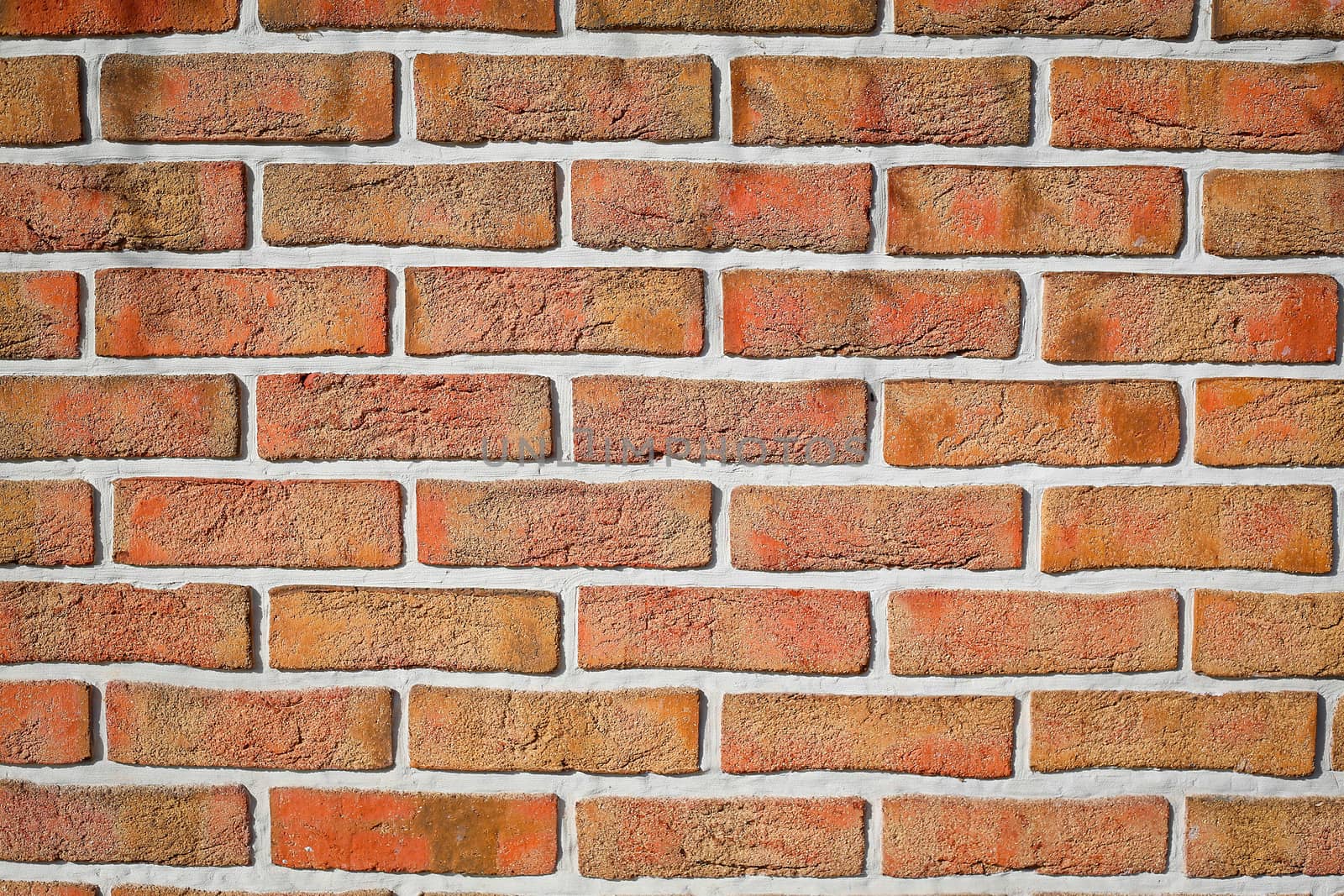 The brick wall of the cracked decorative brick is red .Texture.Background.