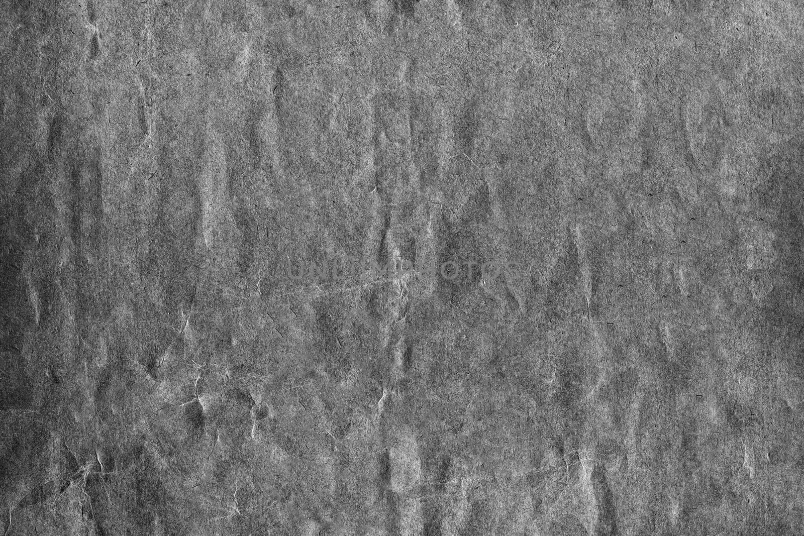 Black and white strongly crumpled background or paper texture