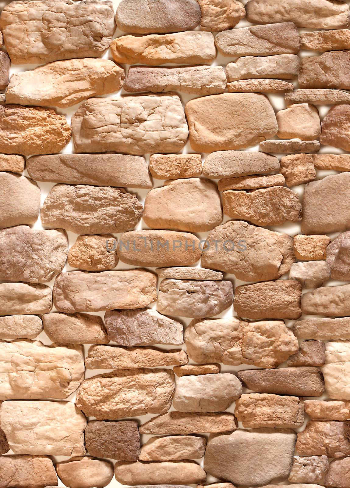 Decorative overlay stone in the form of coffee-colored cobblestones .Texture or background.