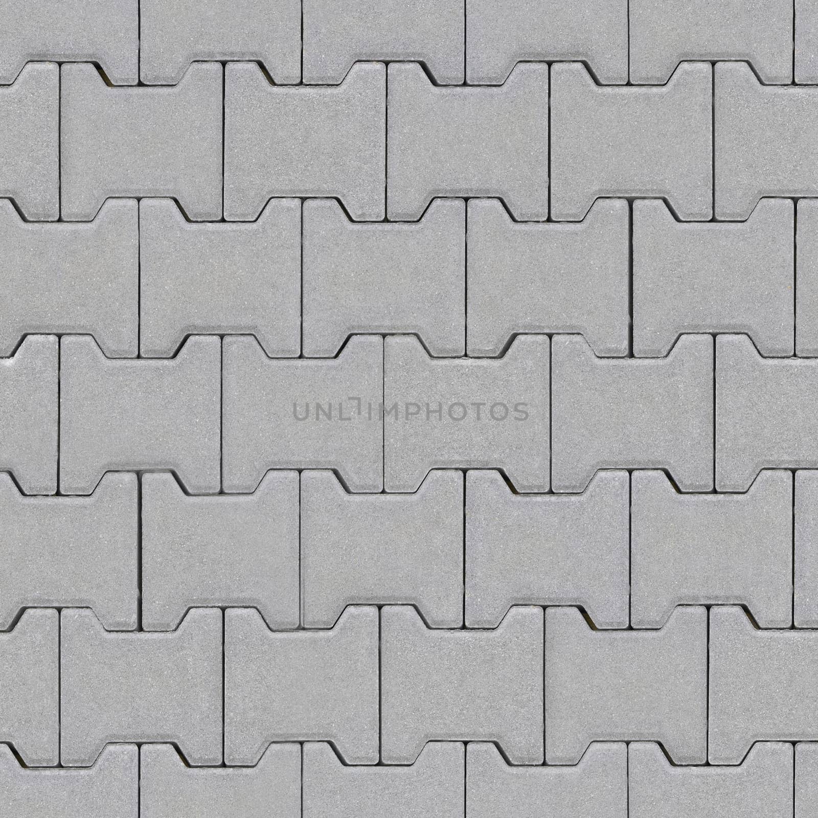 The road is lined with bricks of dark gray with textured surface.Texture or background