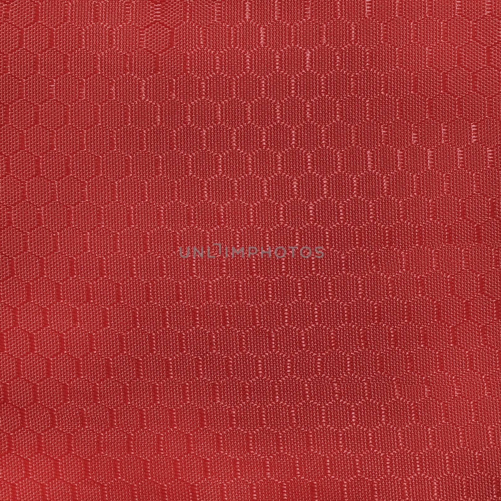 Fabric with a geometric pattern in the form of a diamond dark red.Texture or background