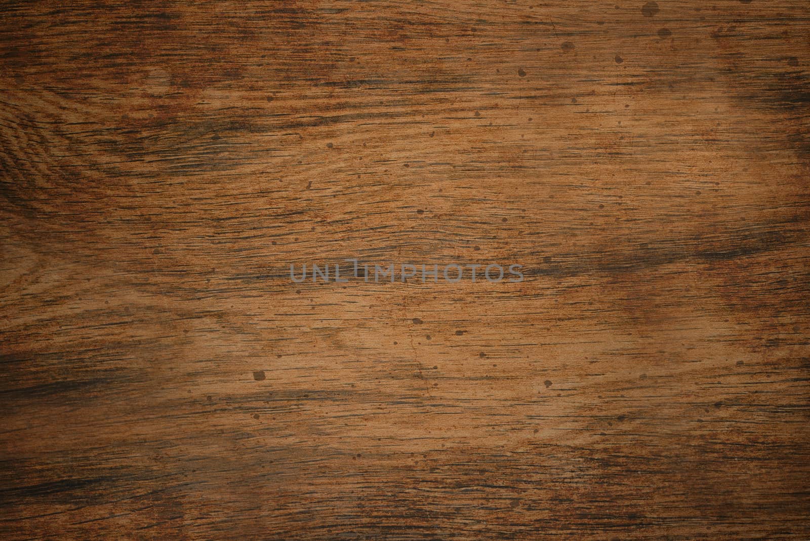 The old wooden Board is brown with a rough texture and streaks on the surface .Texture or background