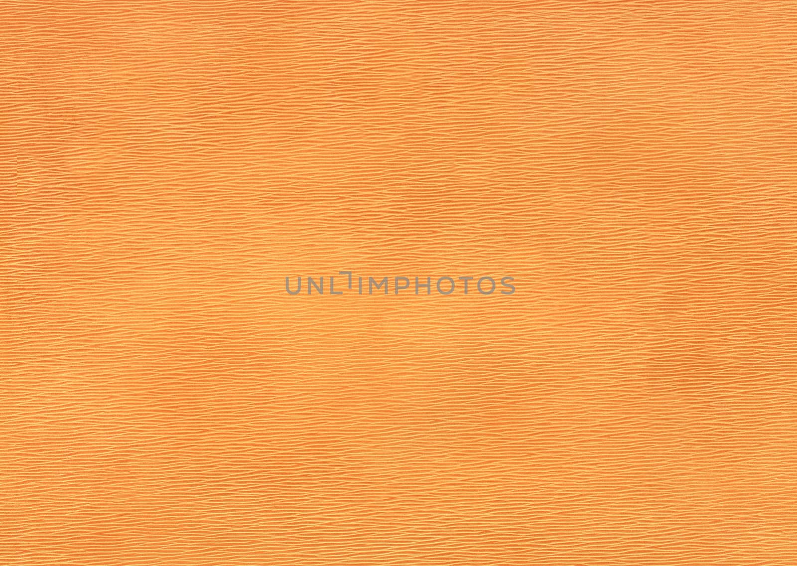 Orange colored paper with embossed diamond pattern.Texture or background