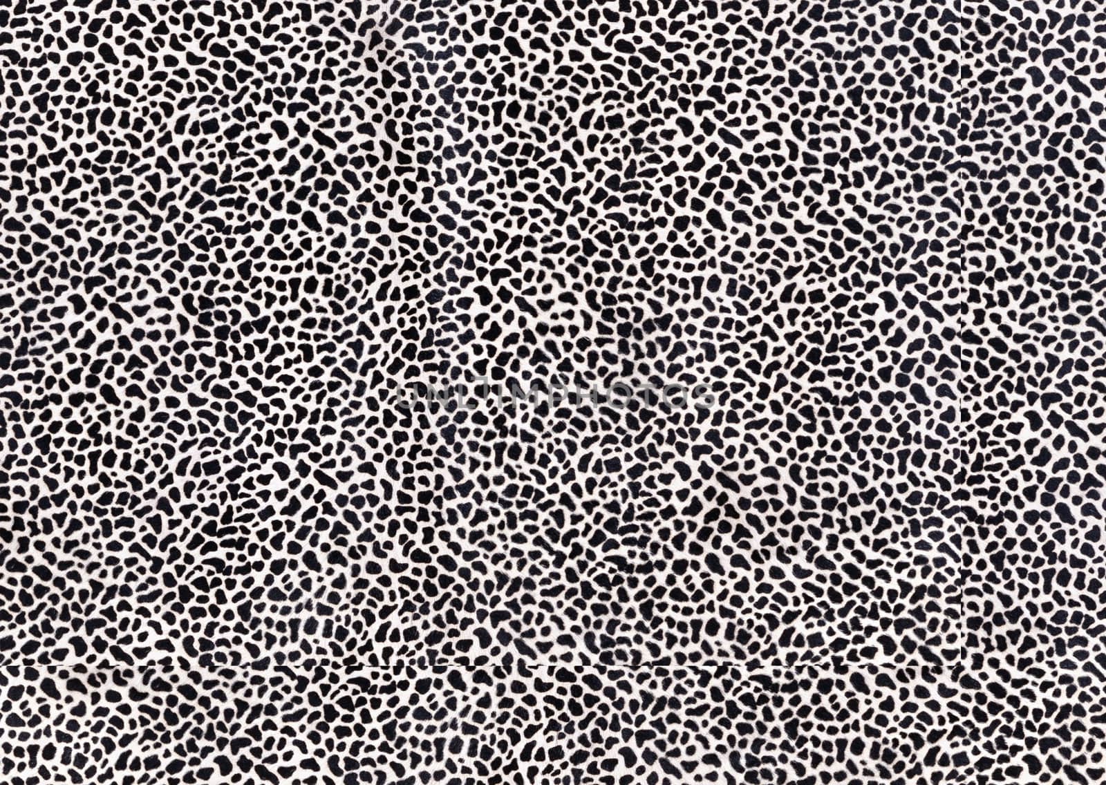 Short-haired fur with lots of black spots.Texture or background