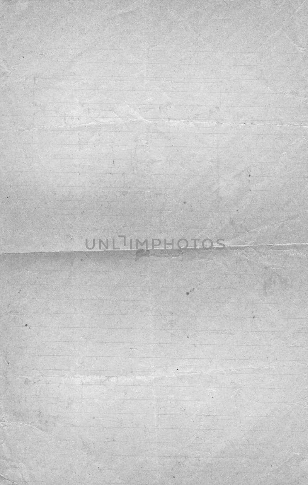 A sheet of white paper with a crumpled surface