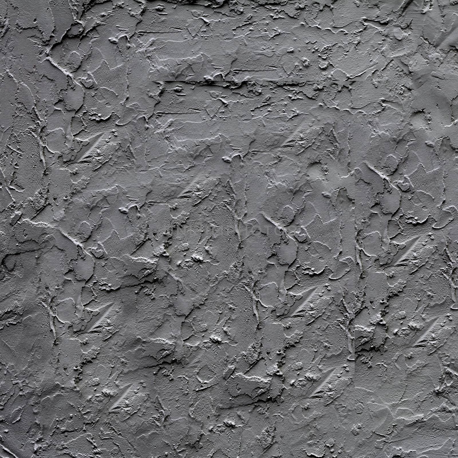 Uneven dark gray plaster applied to the wall surface