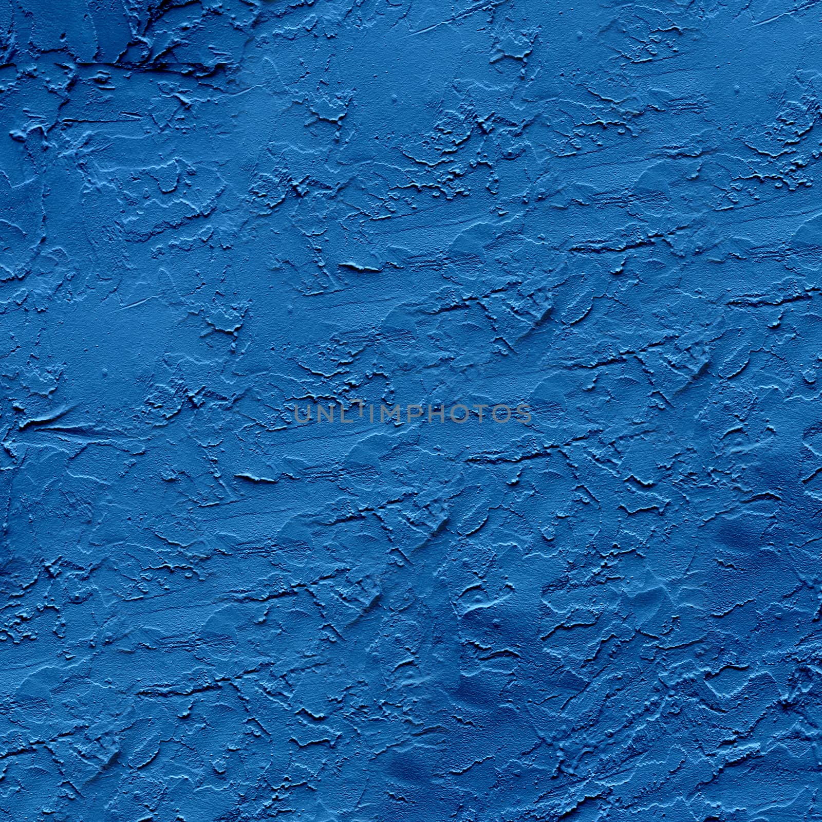 Uneven dark blue plaster applied to the wall surface