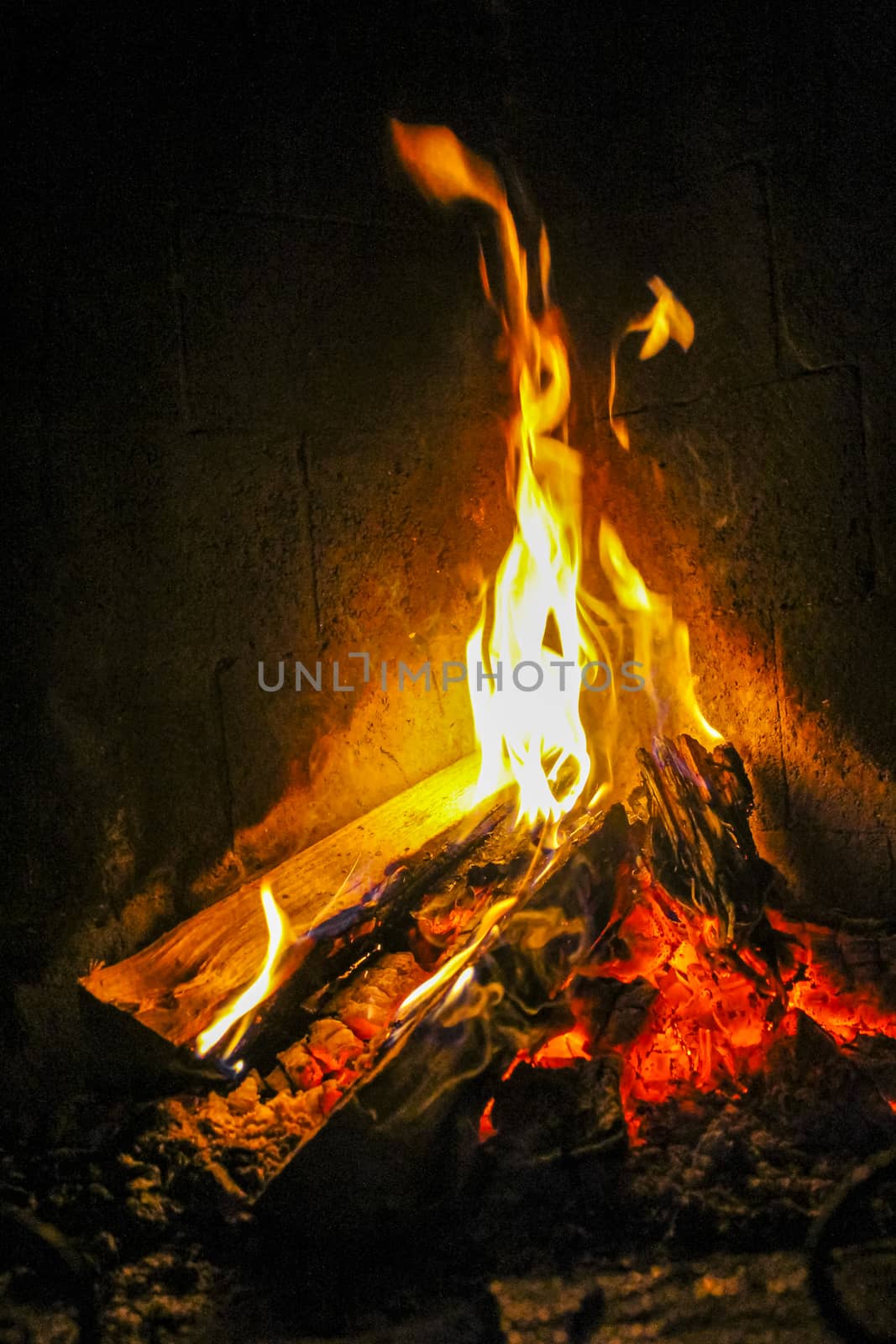 Romantic bright open fire on wood in a hut in beautiful Norway.