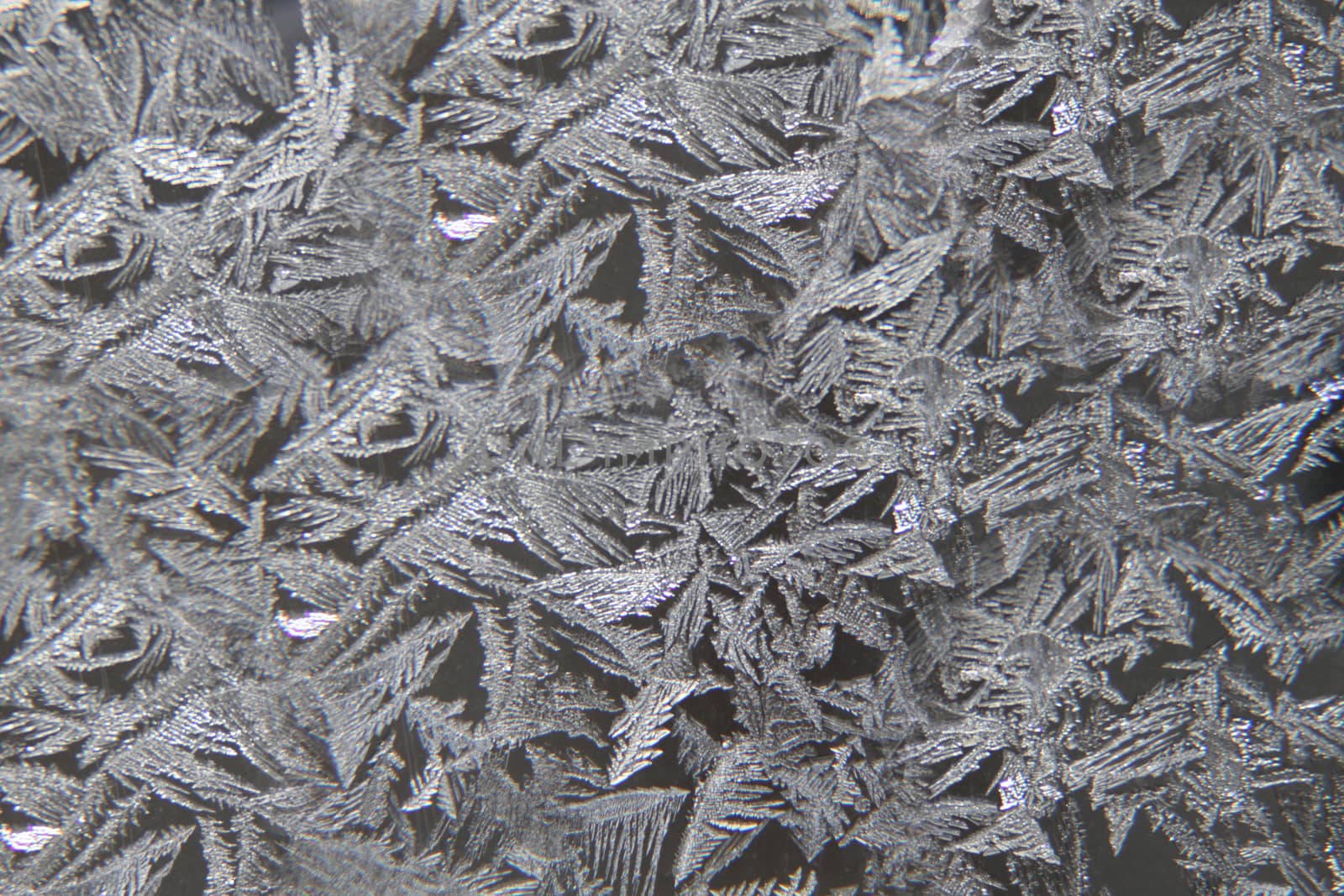 Frosty pattern on the surface of the window .Texture or background