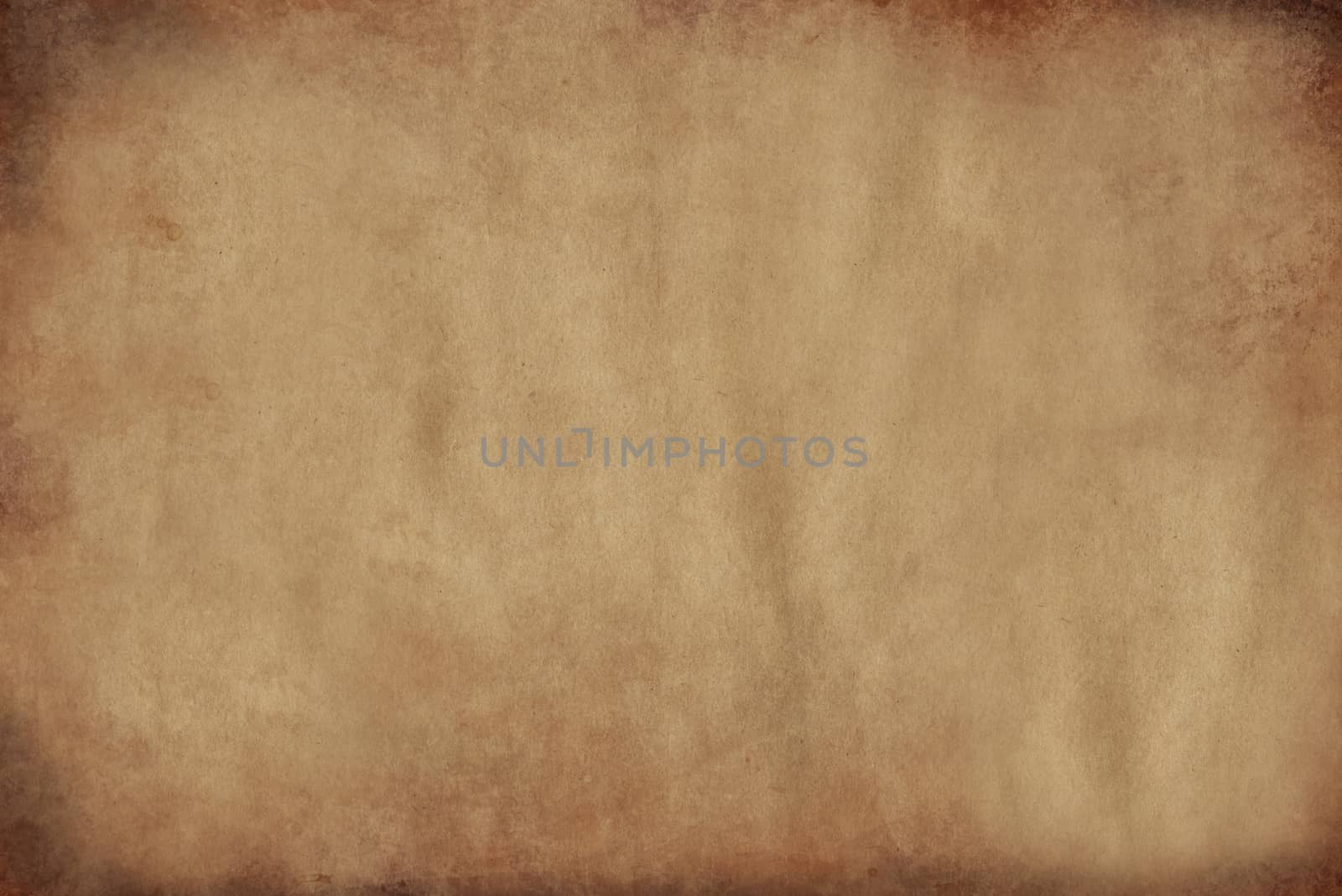 Old yellowed parchment paper with burnt edges .Texture or background