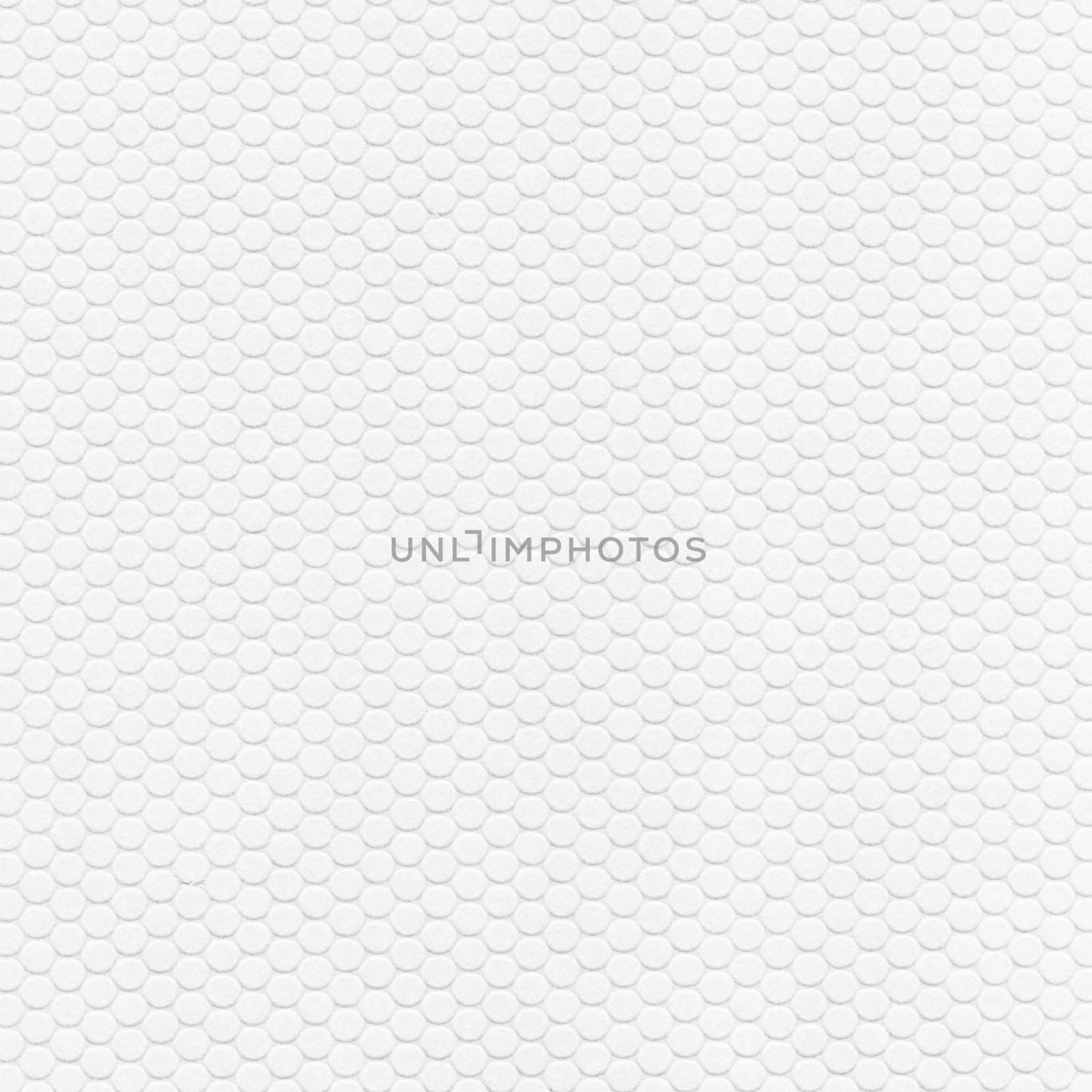 A large number of round-shaped geometric shapes are placed on the white sheet .Texture or background
