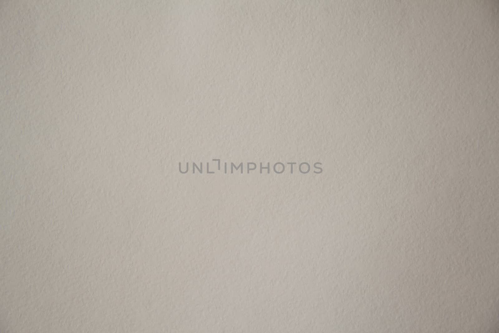 Sheet of dense cardboard with a textured surface of light brown color. Texture or background