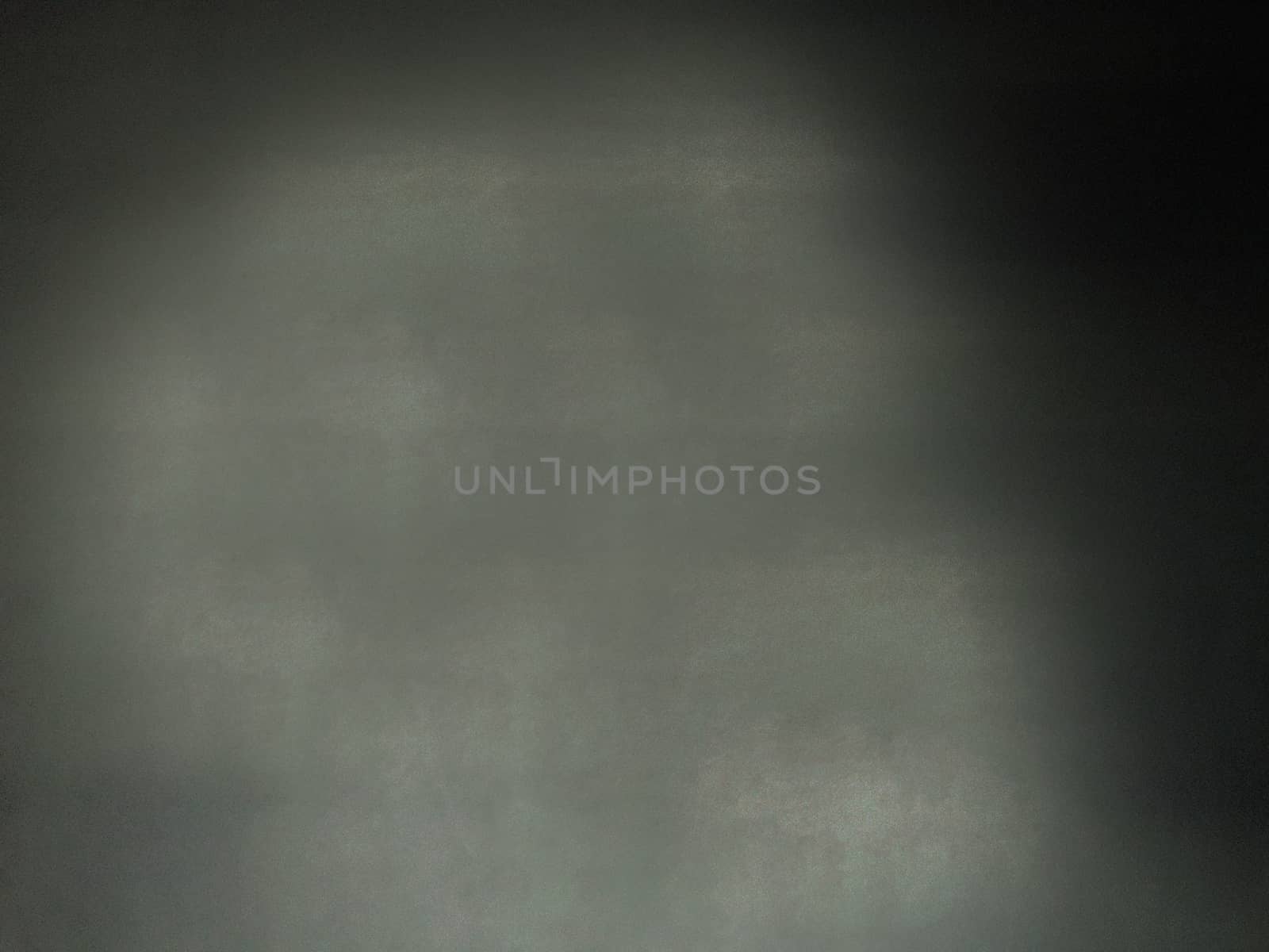 The wall is dark black with a rough textured blank surface.Texture or background.