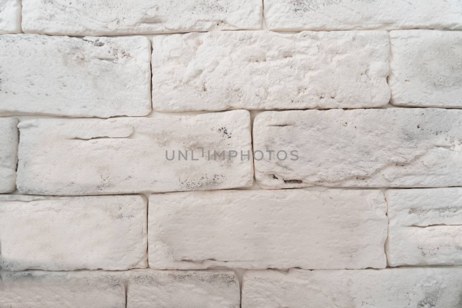 Square white brick wall .Texture or font
