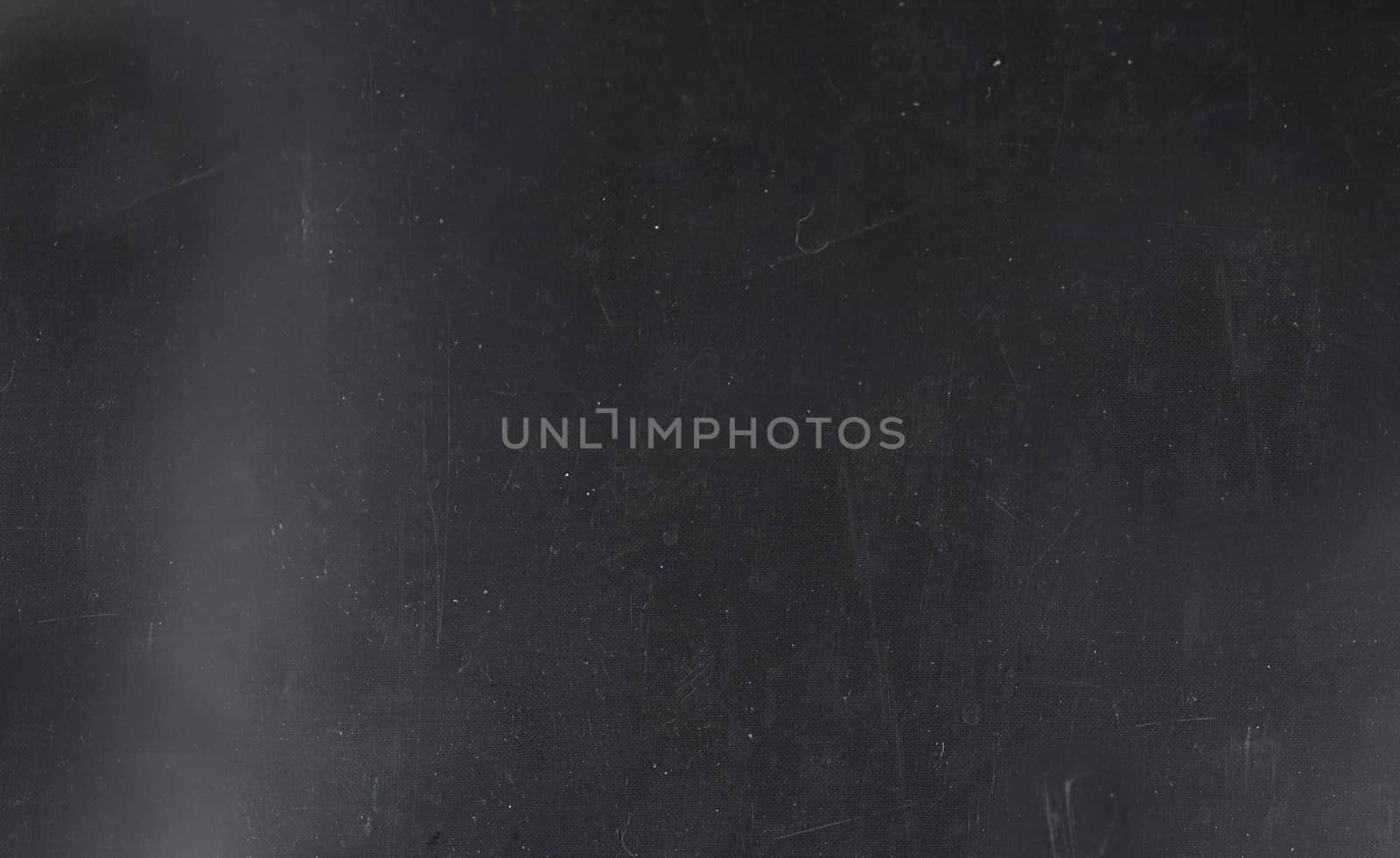 Grunge on a dark blue background with scratches and lint on the surface.Texture or background
