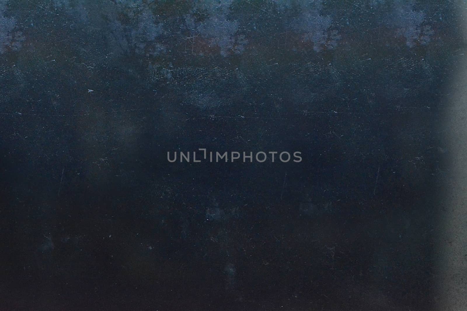 Grunge on a dark gray background with scratches and roughness on the surface