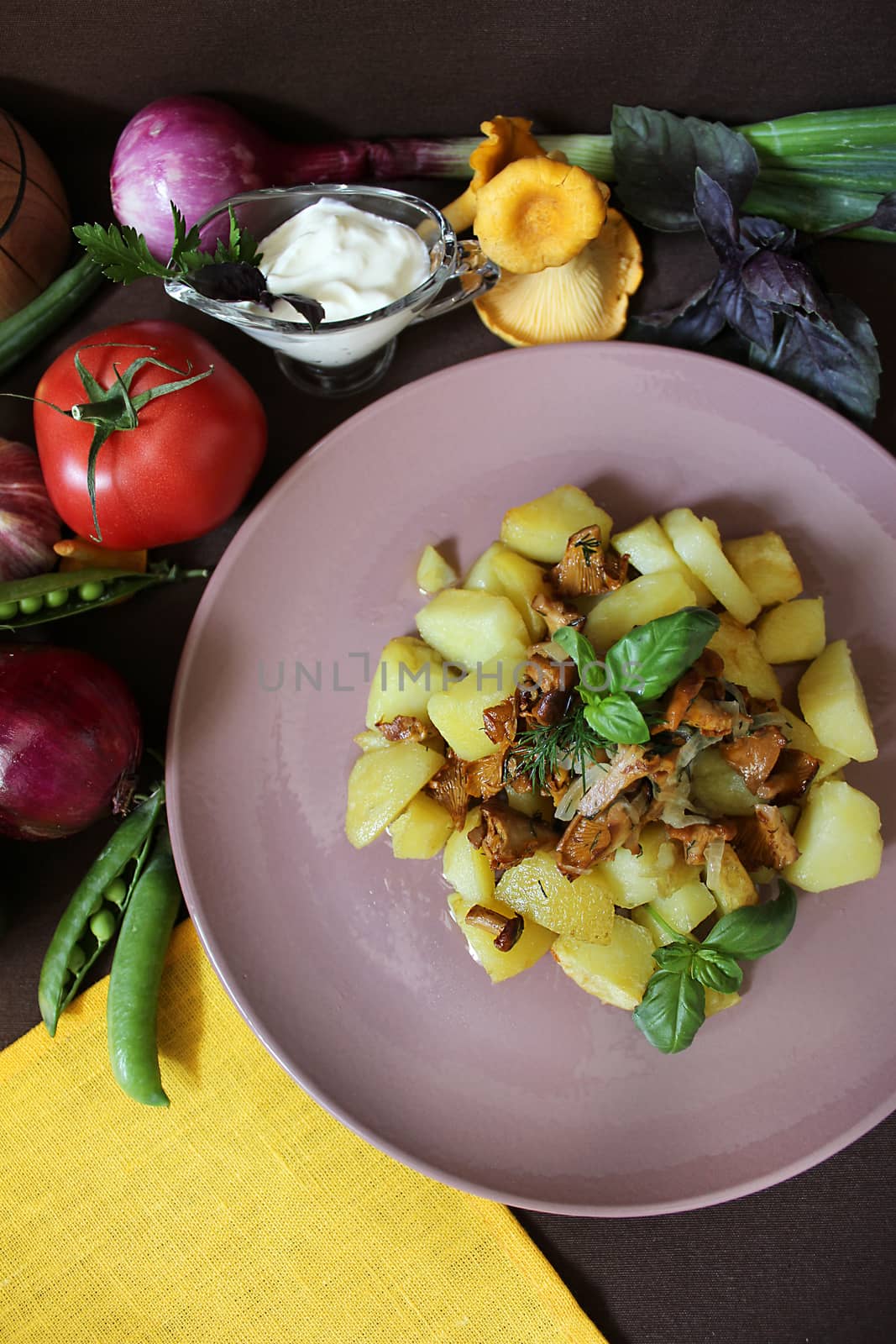Country food fried potatoes with chanterelles and greens