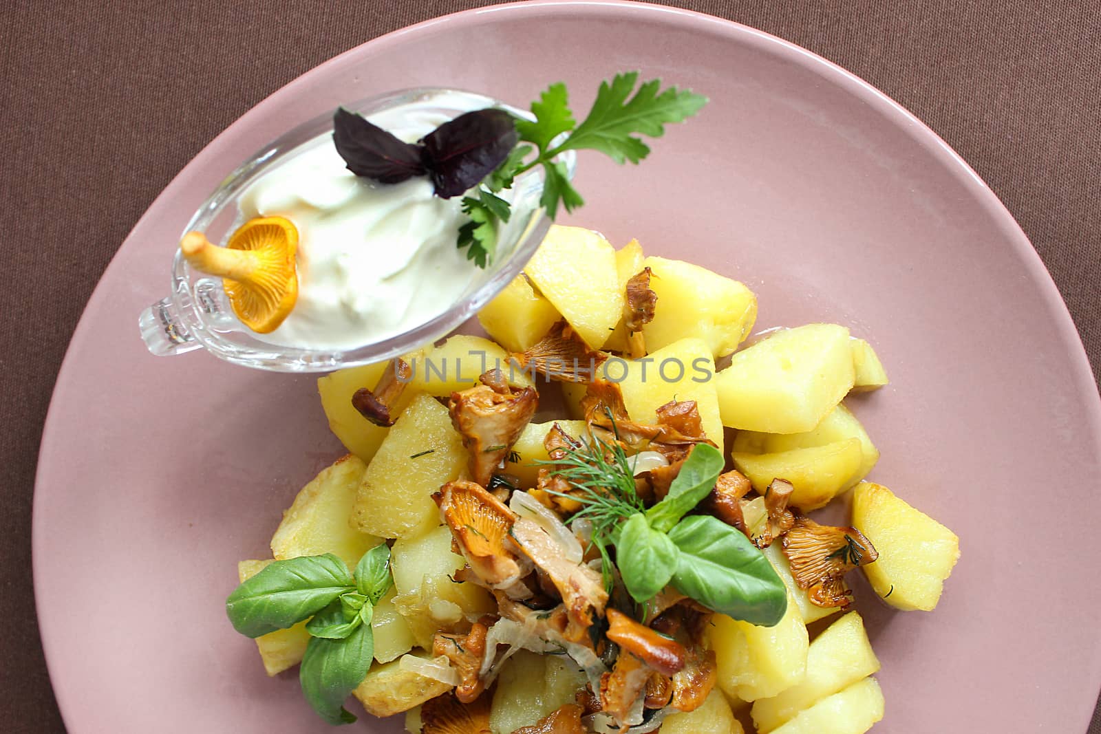 Russian cuisine fried chanterelles with potatoes and herbs.Texture or background