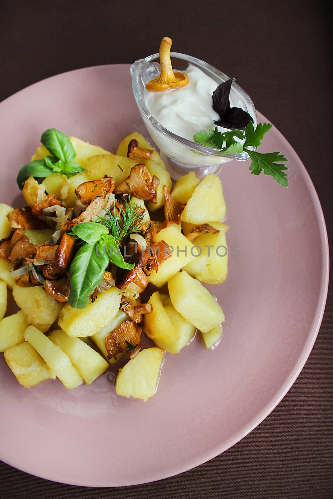 Fried onion with mushrooms with potatoes and herbs.Texture or background