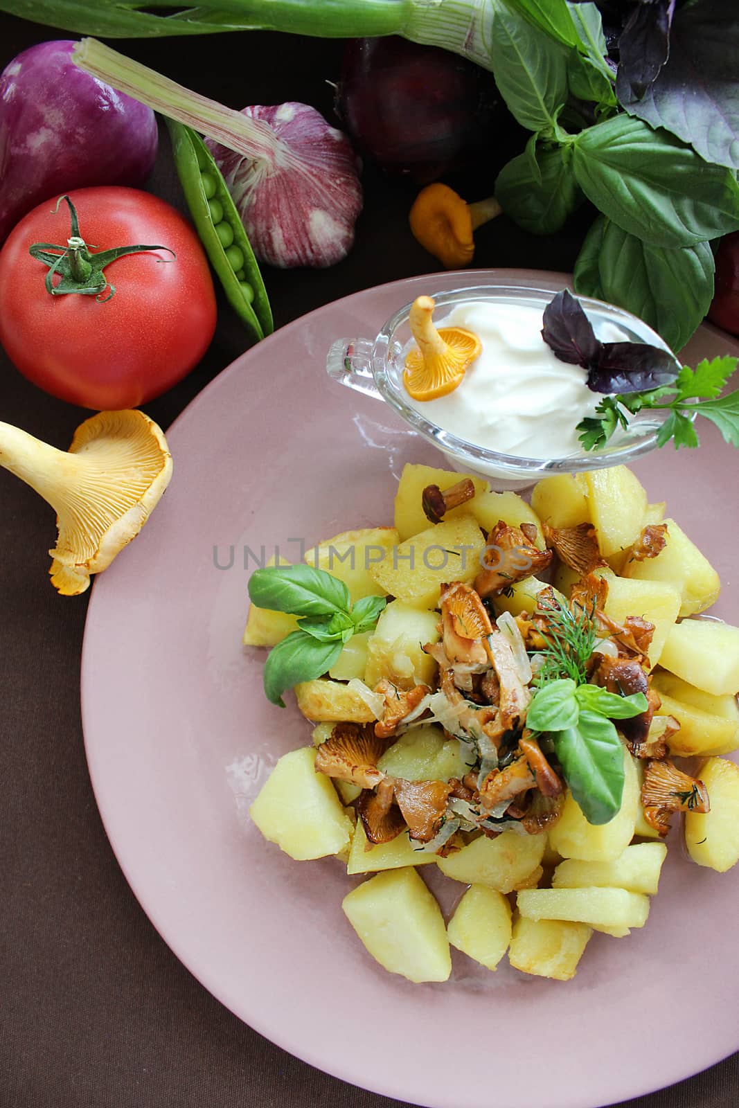 Fried potatoes with herbs and mushrooms with garlic sauce