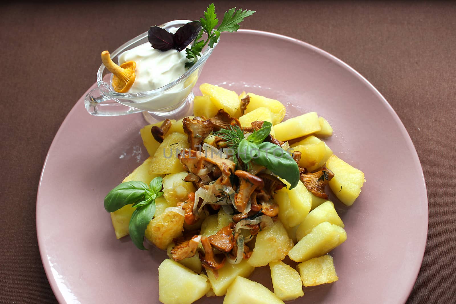 Belarusian cuisine fried mushrooms with fried potatoes and herbs.Texture or background