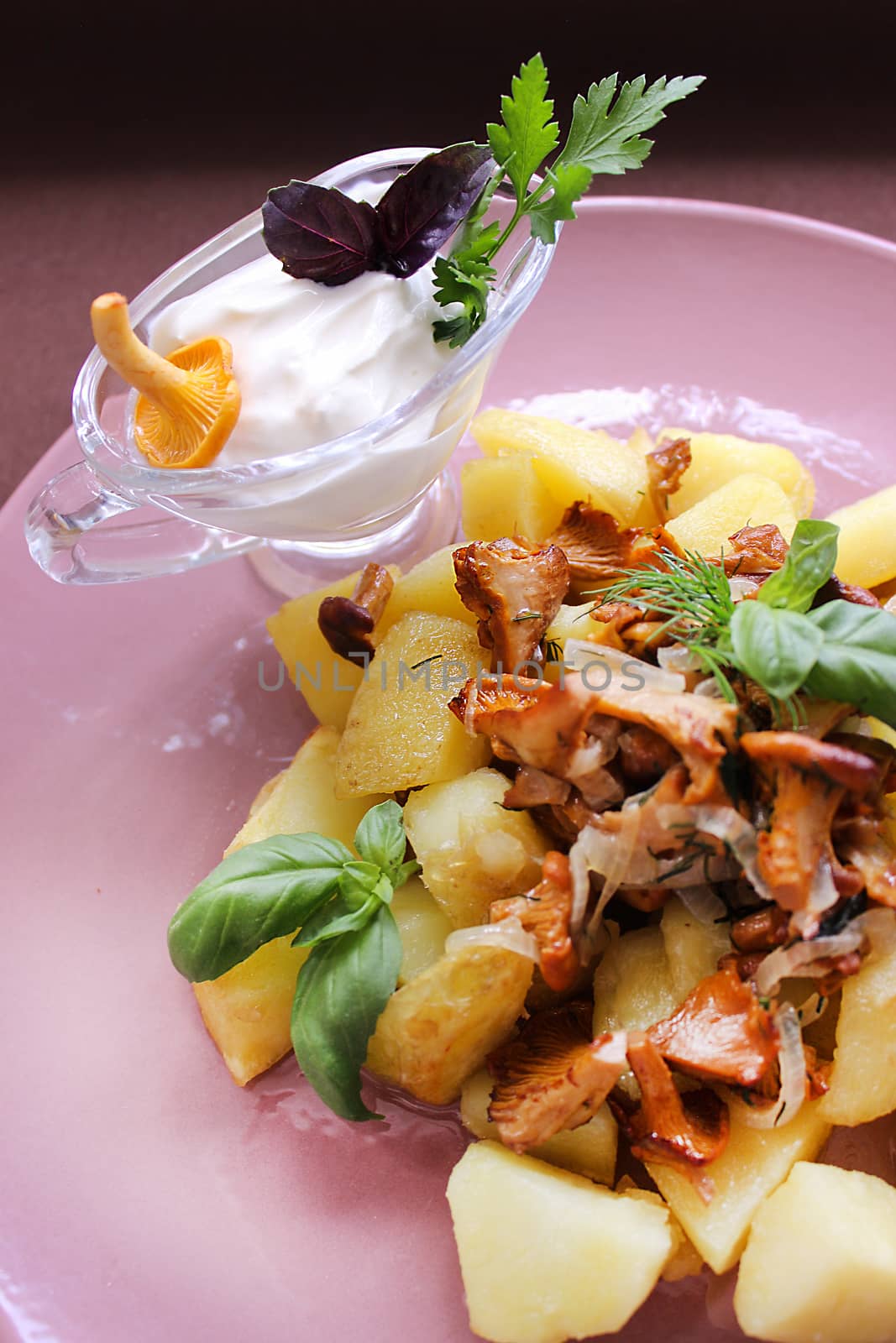 Belarusian cuisine fried mushrooms with fried potatoes and herbs.Texture or background