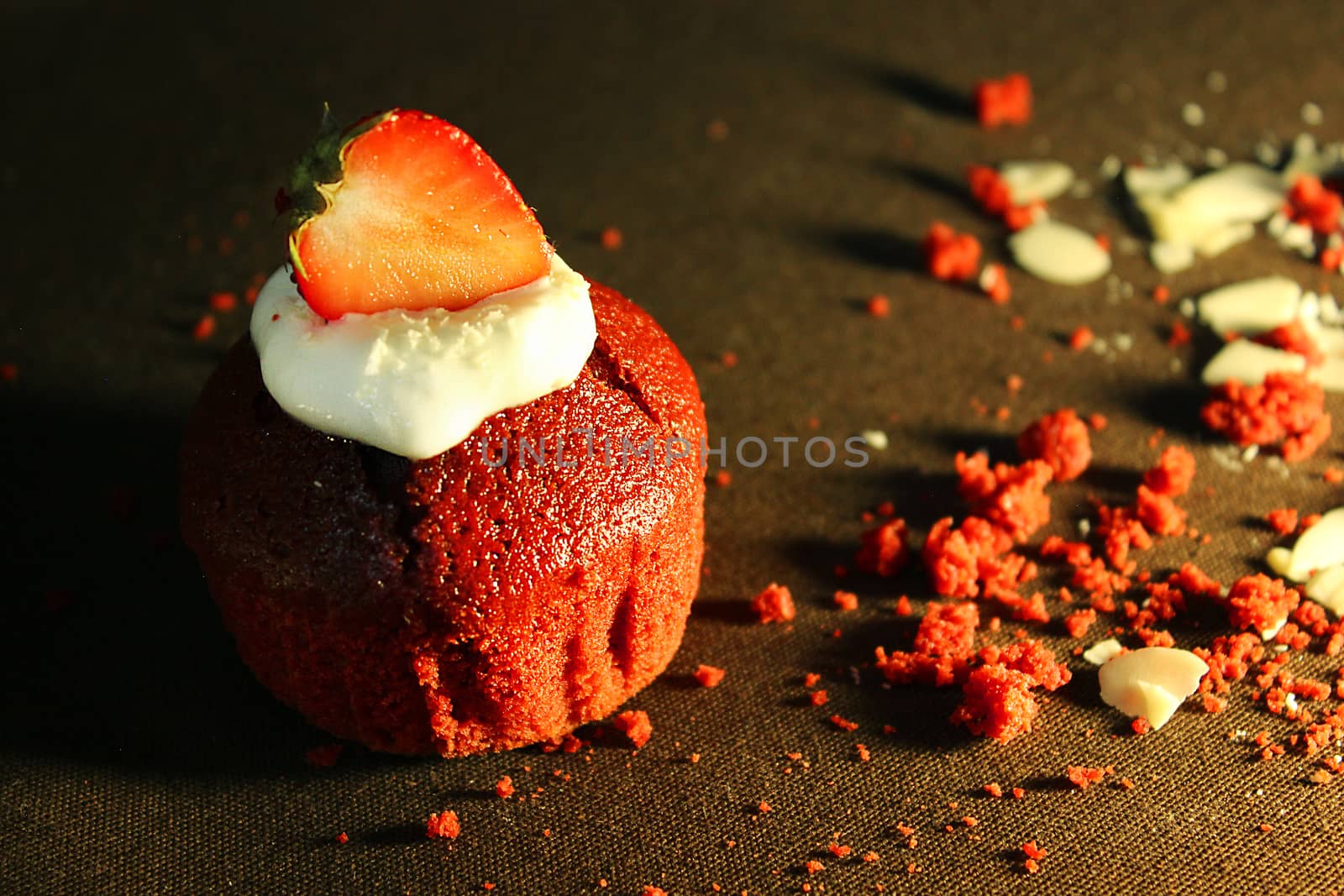 The prepared cake is decorated with a strawberry slice and .Texture or background