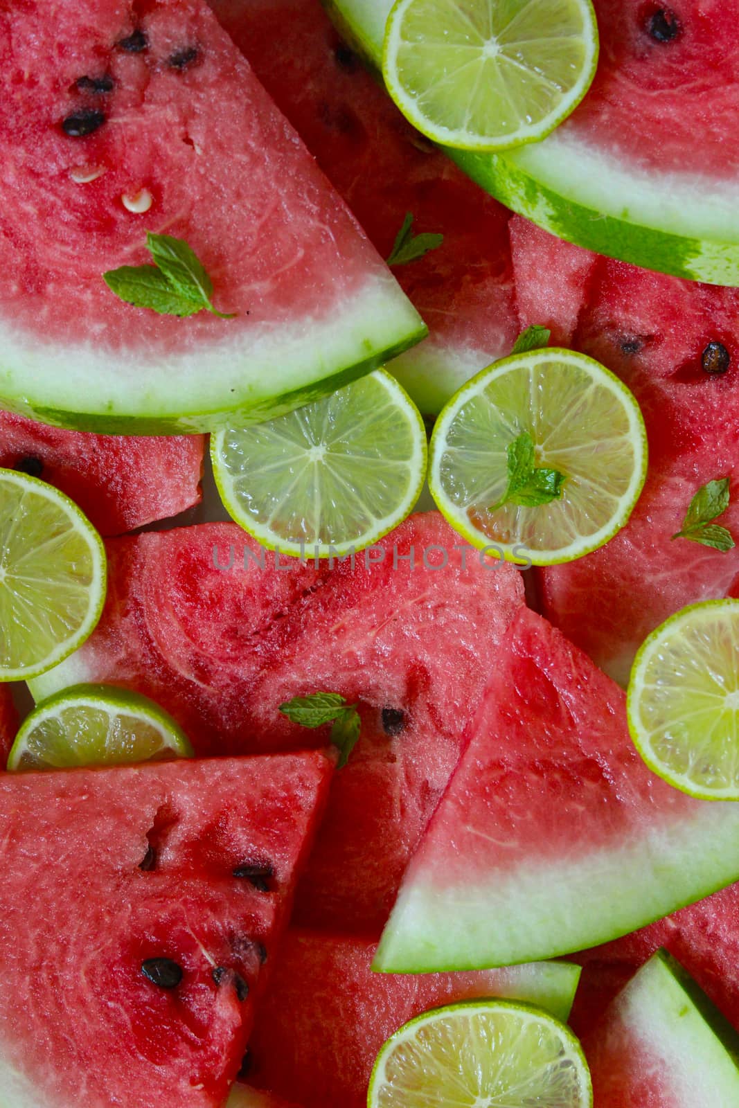 Fresh slices of juicy watermelon with lime.Texture or background