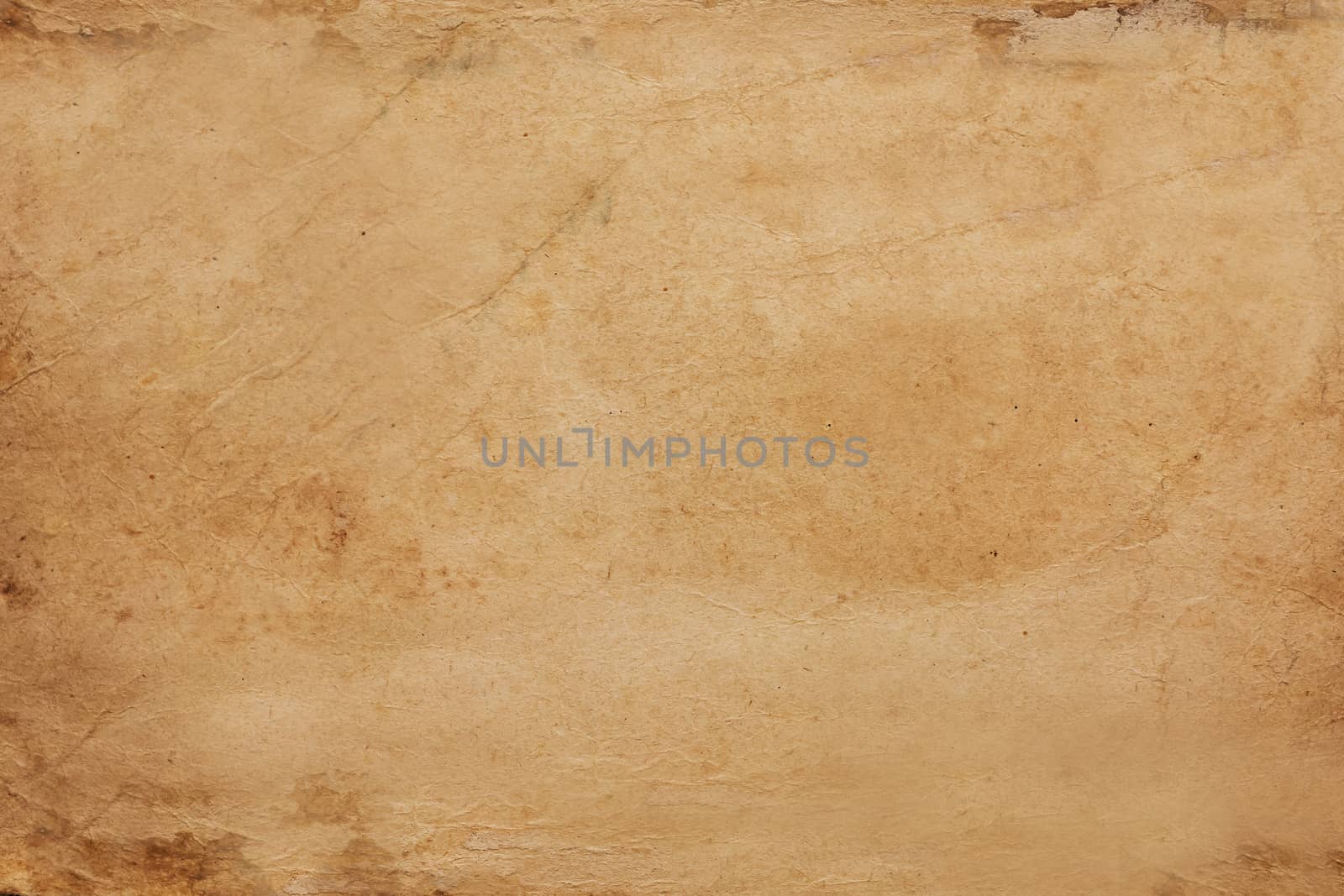 Paper aged by time with spots and scuffs on the surface .Texture or background