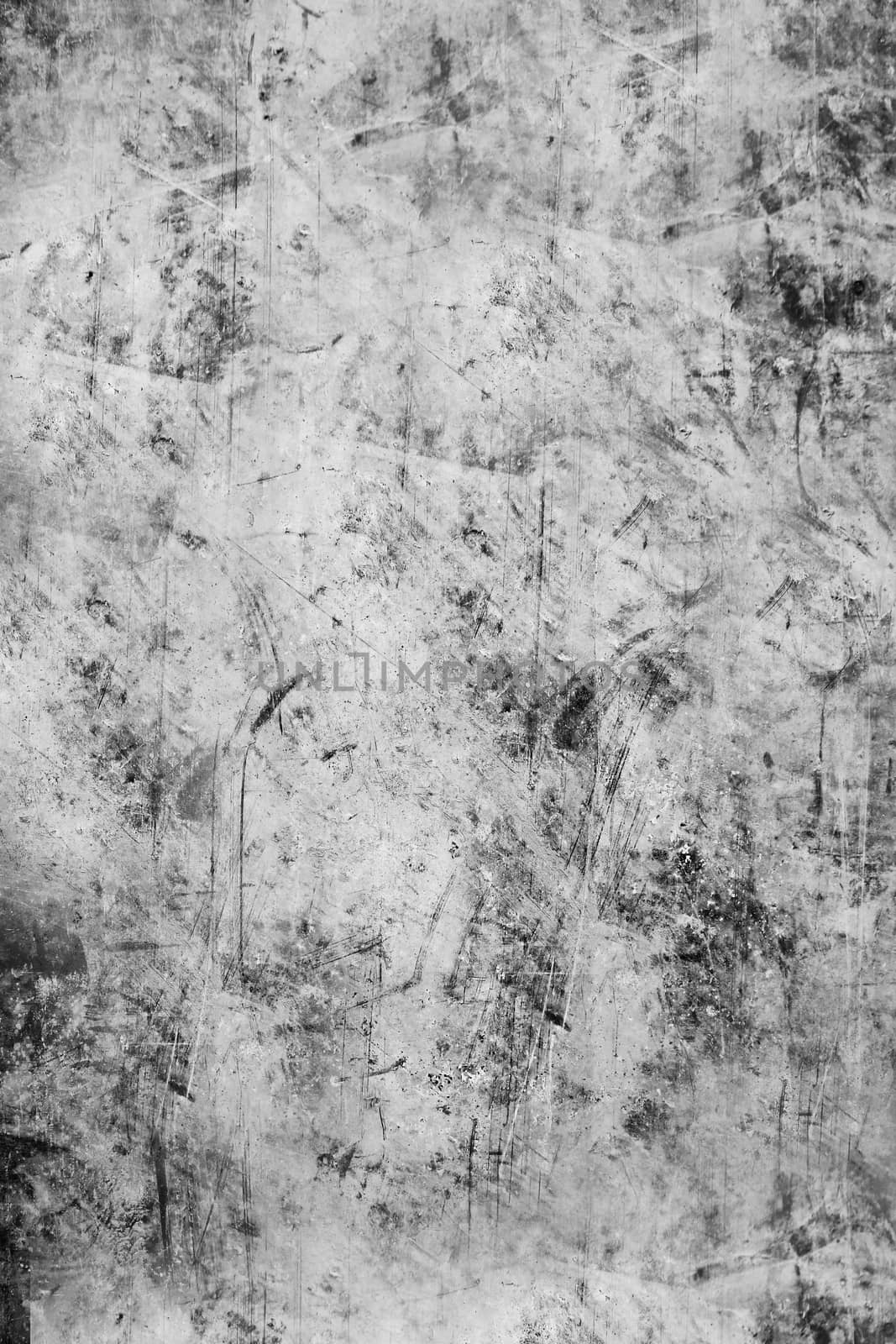 The scratched textured surface of the concrete wall is grey . Texture or background.