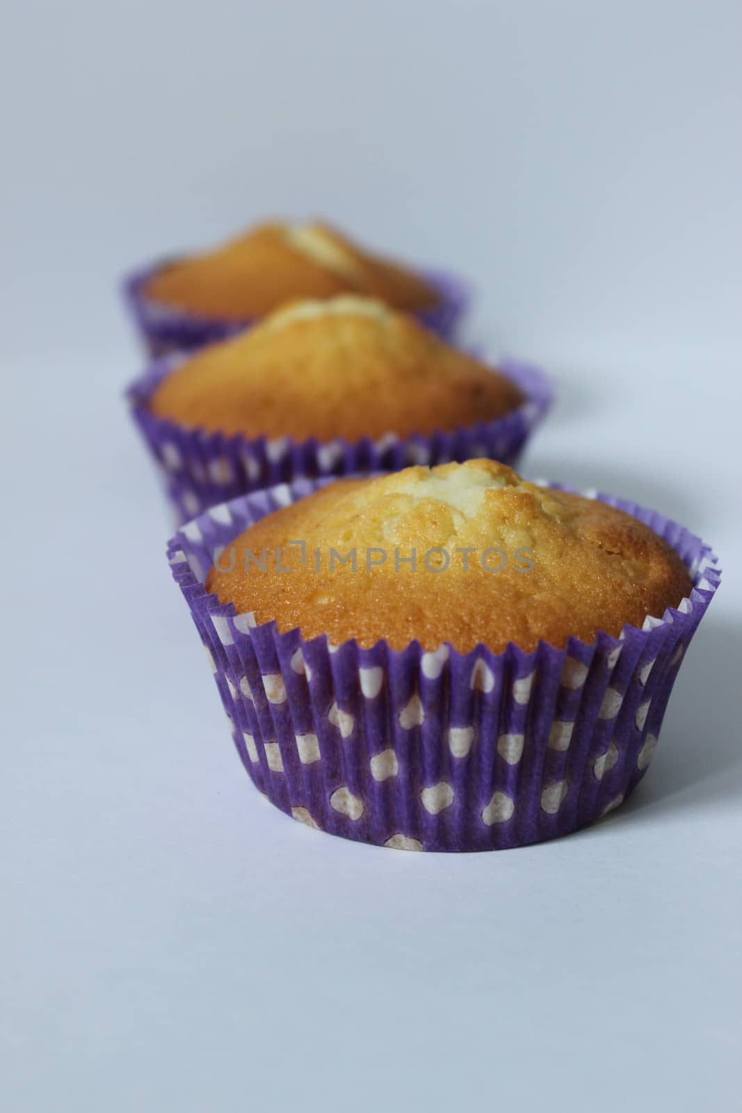 Three vanilla-flavored cupcakes home-baked .Texture or background