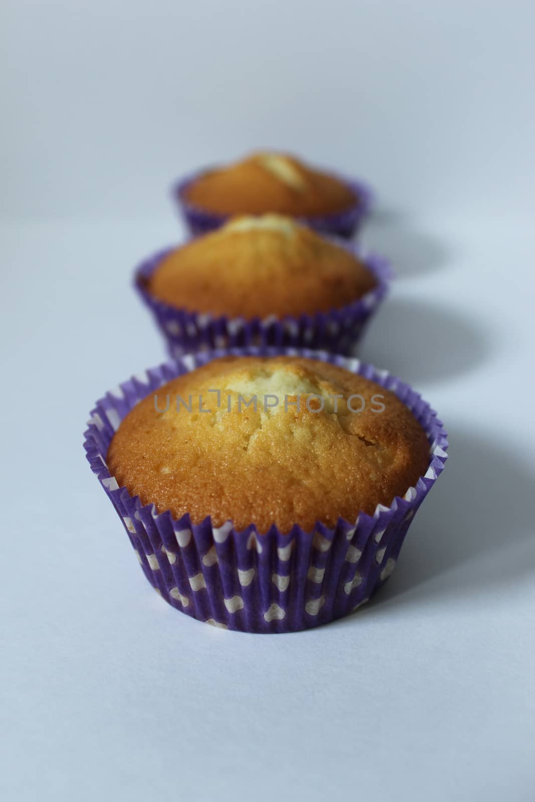 Three cupcakes home-made dessert for tea.Texture or background