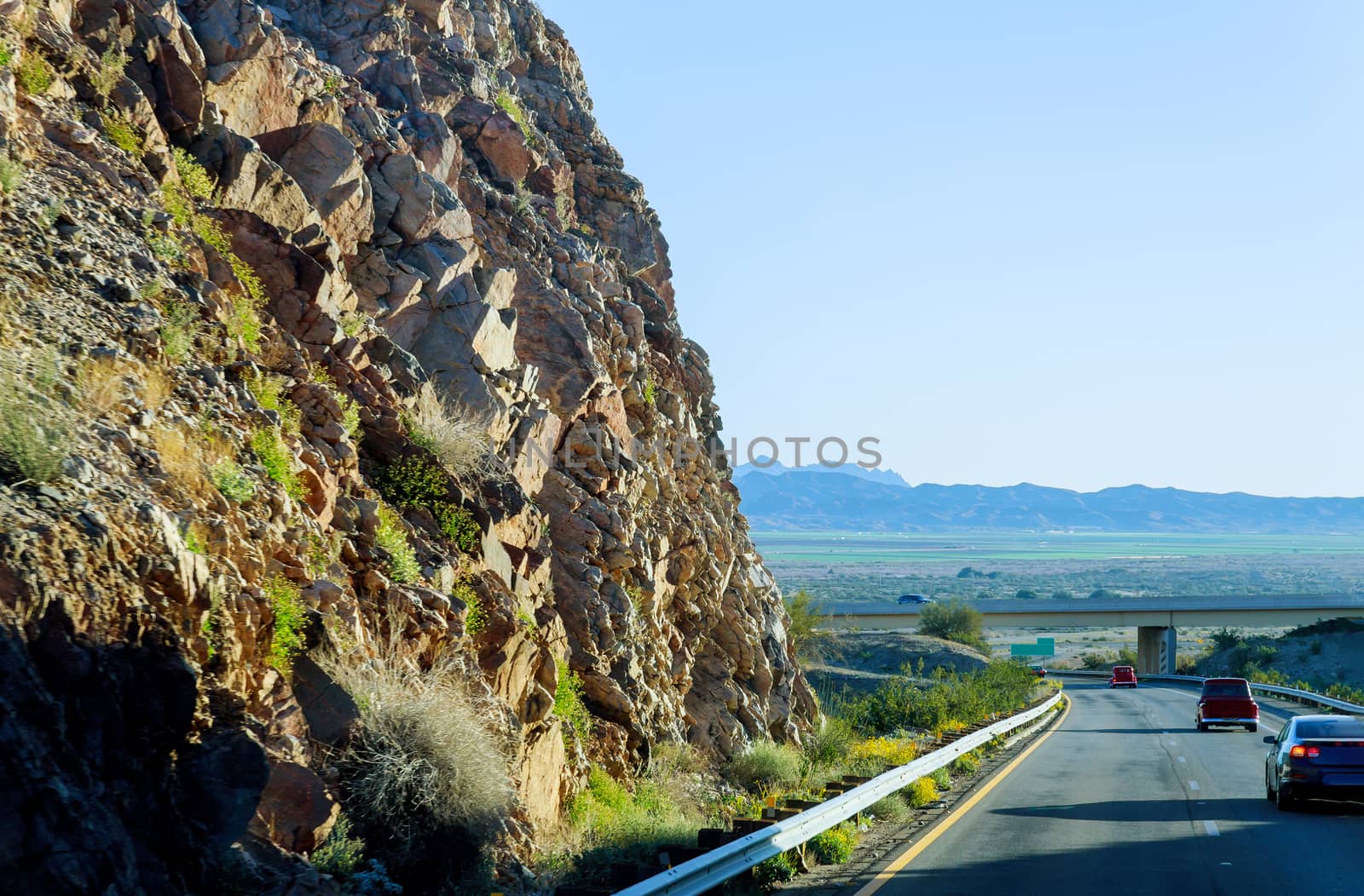 View of a road in desert with rock mountain highway New Mexico landscape