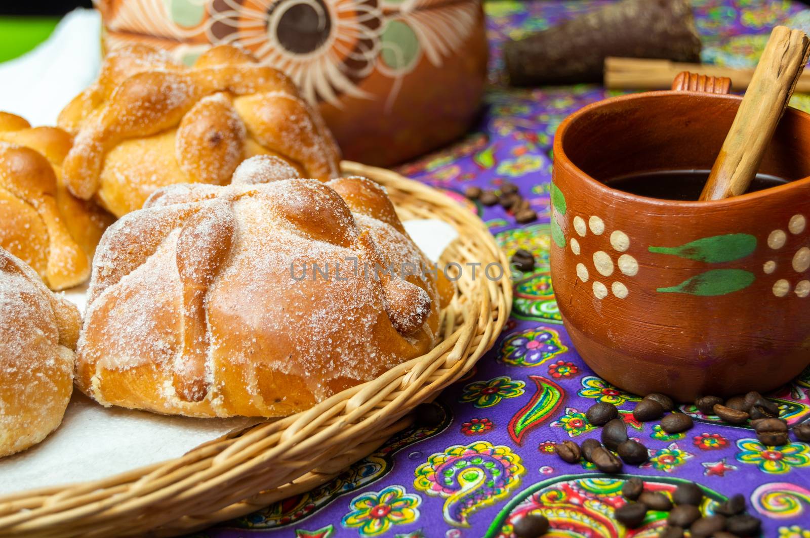 Traditional Mexican bread of the dead pan de muerto served with coffee from the pot cafe de olla, this bread is made around the day of the dead celebration and is often left on altars of remembrance