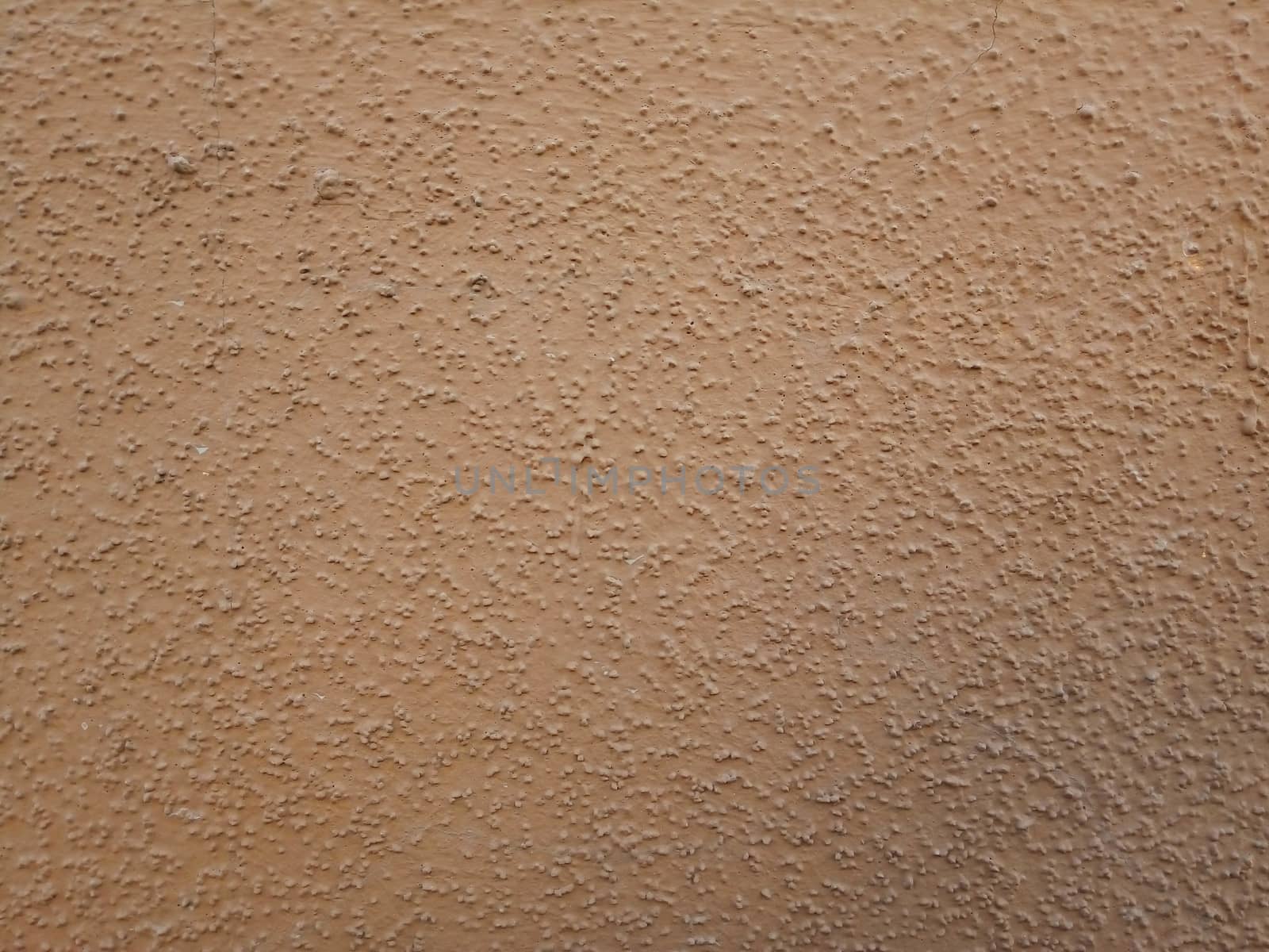 Brown plaster walls. The background of painted wall.