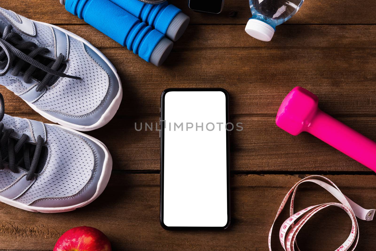 pair sports shoes, water, apple, jump rope and smartphone blank  by Sorapop