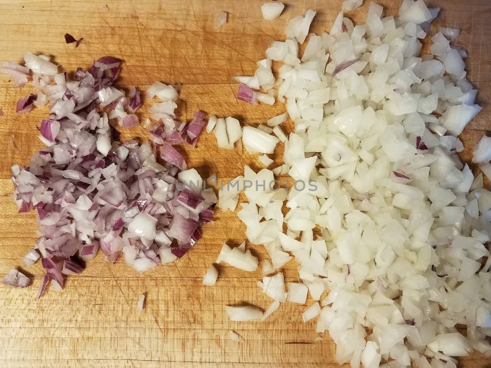 red and white onions on wooden cutting board by stockphotofan1