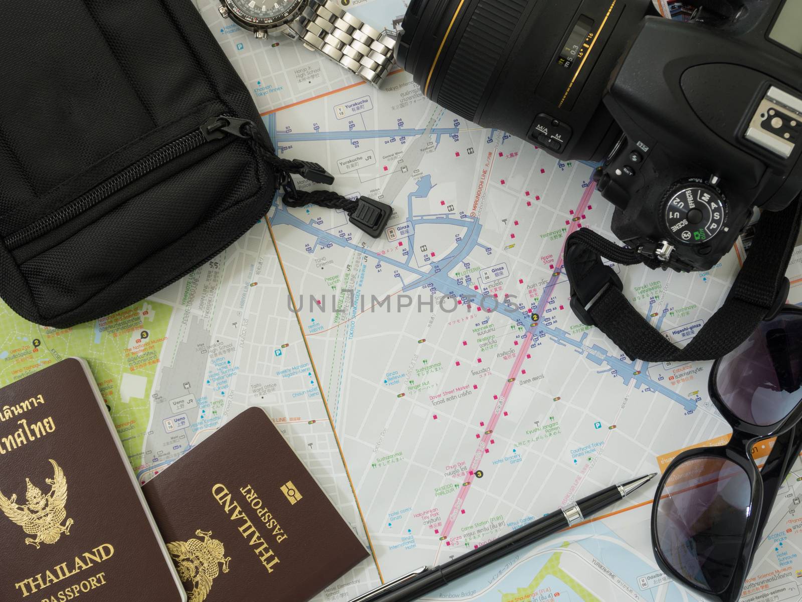 Travel Accessories on wooden table. view above