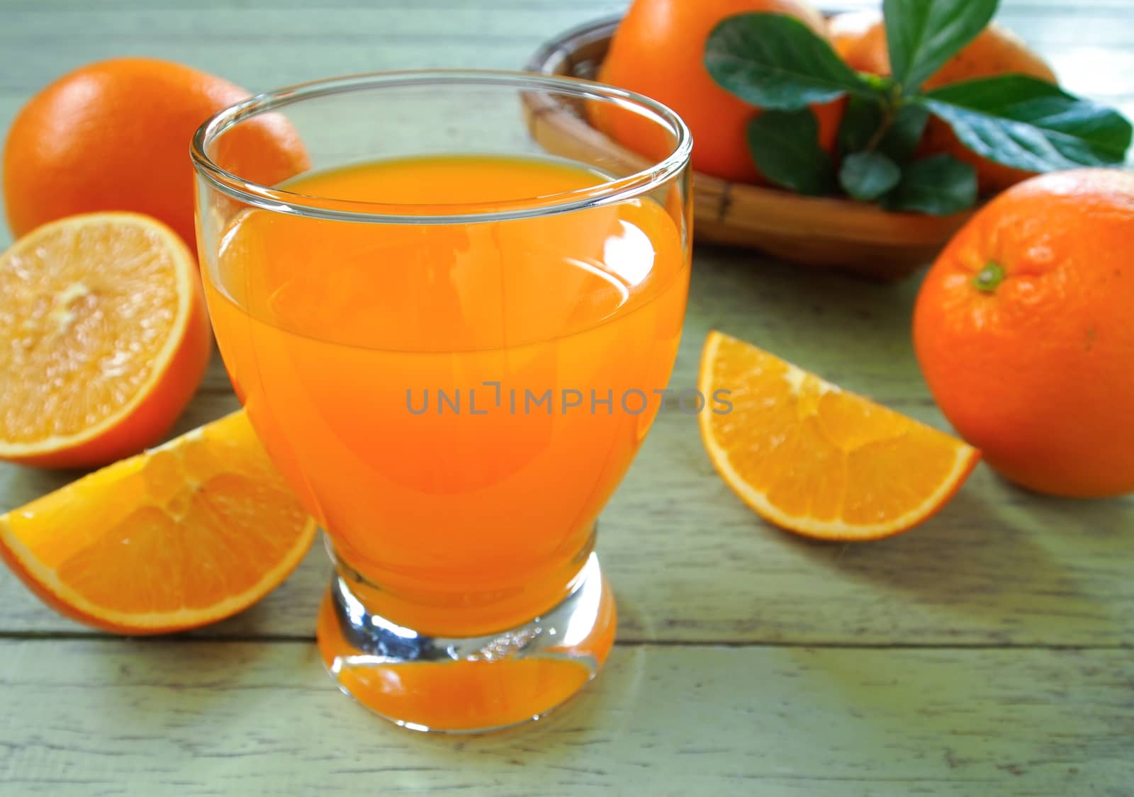 orange fruit and orange juice on wooden table