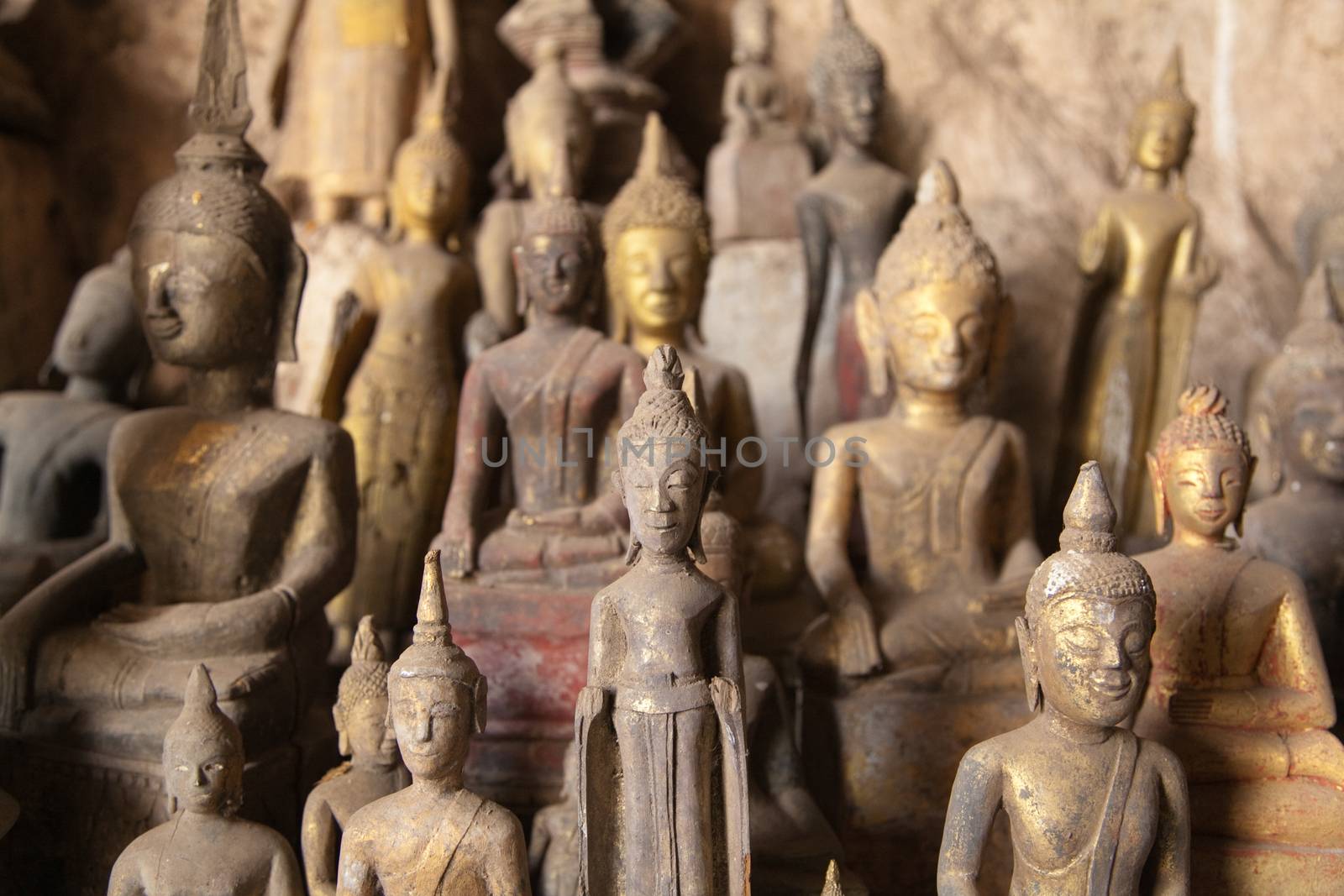 Ou Pak Caves Laos two caves on the west side of the Mekong river, with small and miniature Buddha statues in many different poses placed there for safe keeping and are frequently visited by tourists.. High quality photo