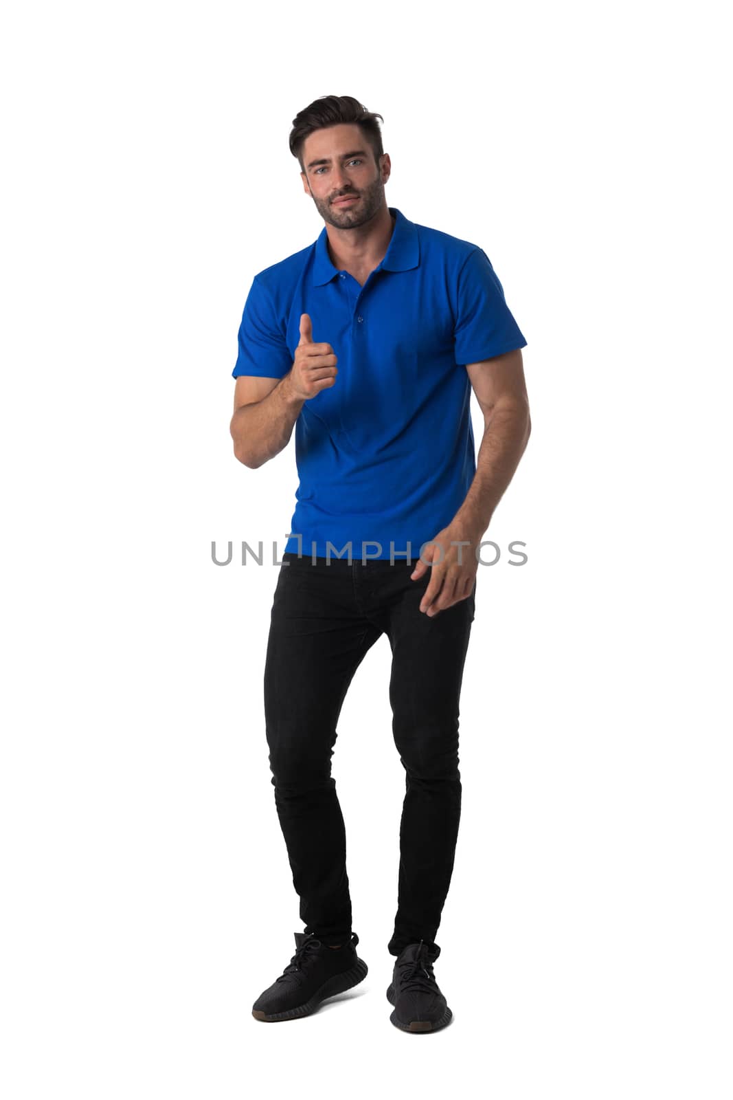 Full length portrait of happy handsome young man showing thumb up isolated on white background, casual people