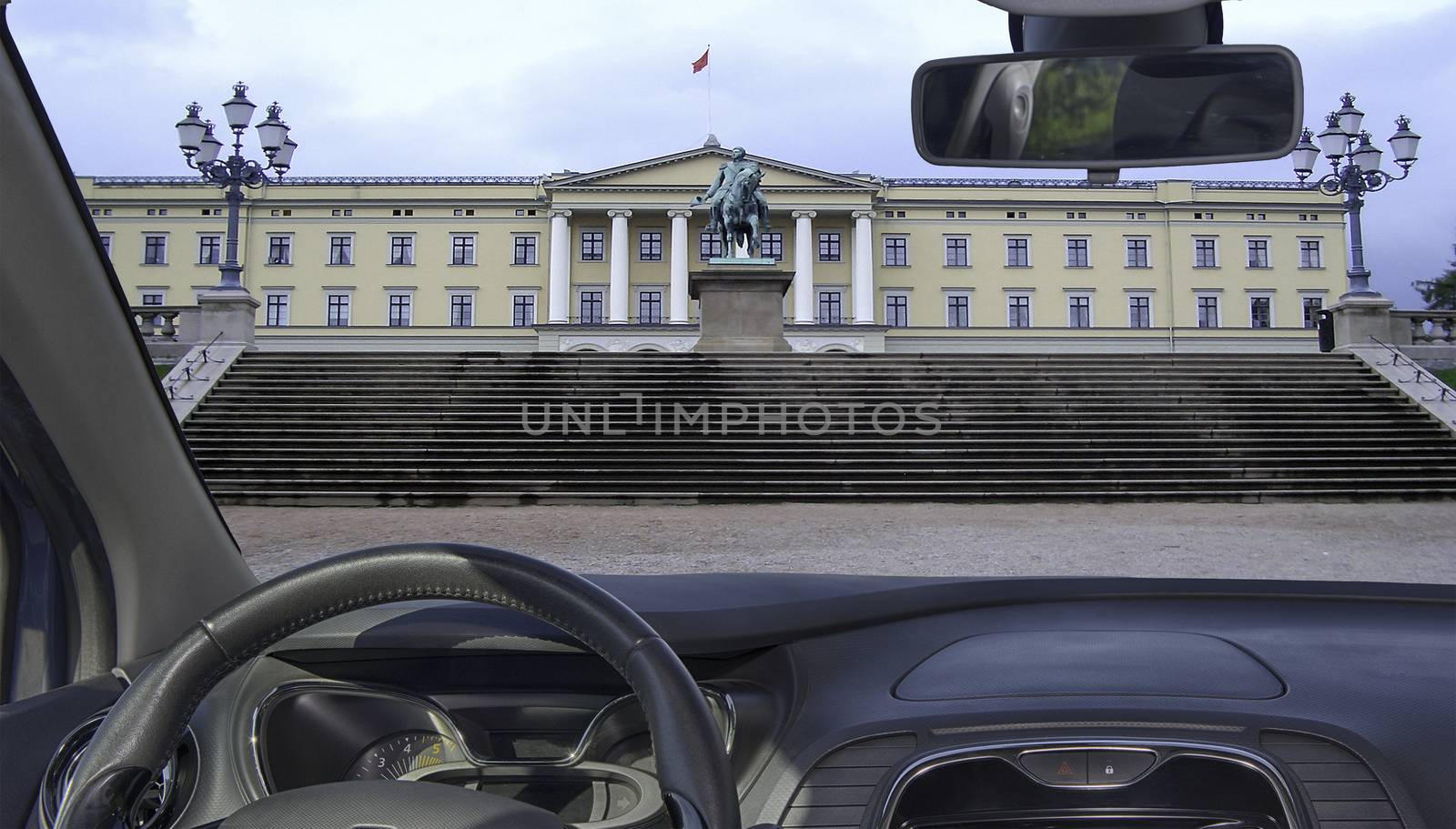 Looking through a car windshield with view of the Royal Palace in Oslo, Norway