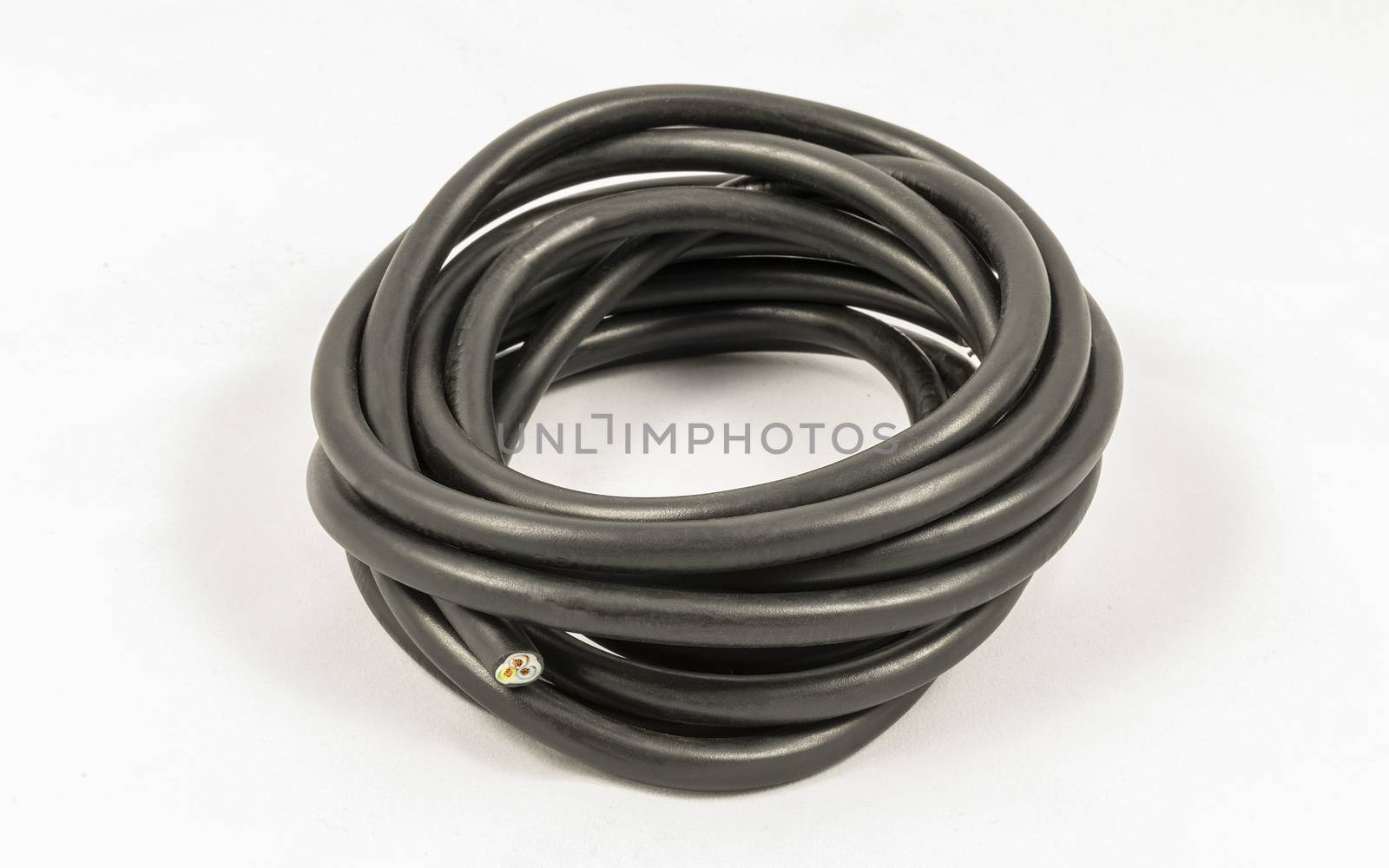 Roll of black electric cable isolated on white background