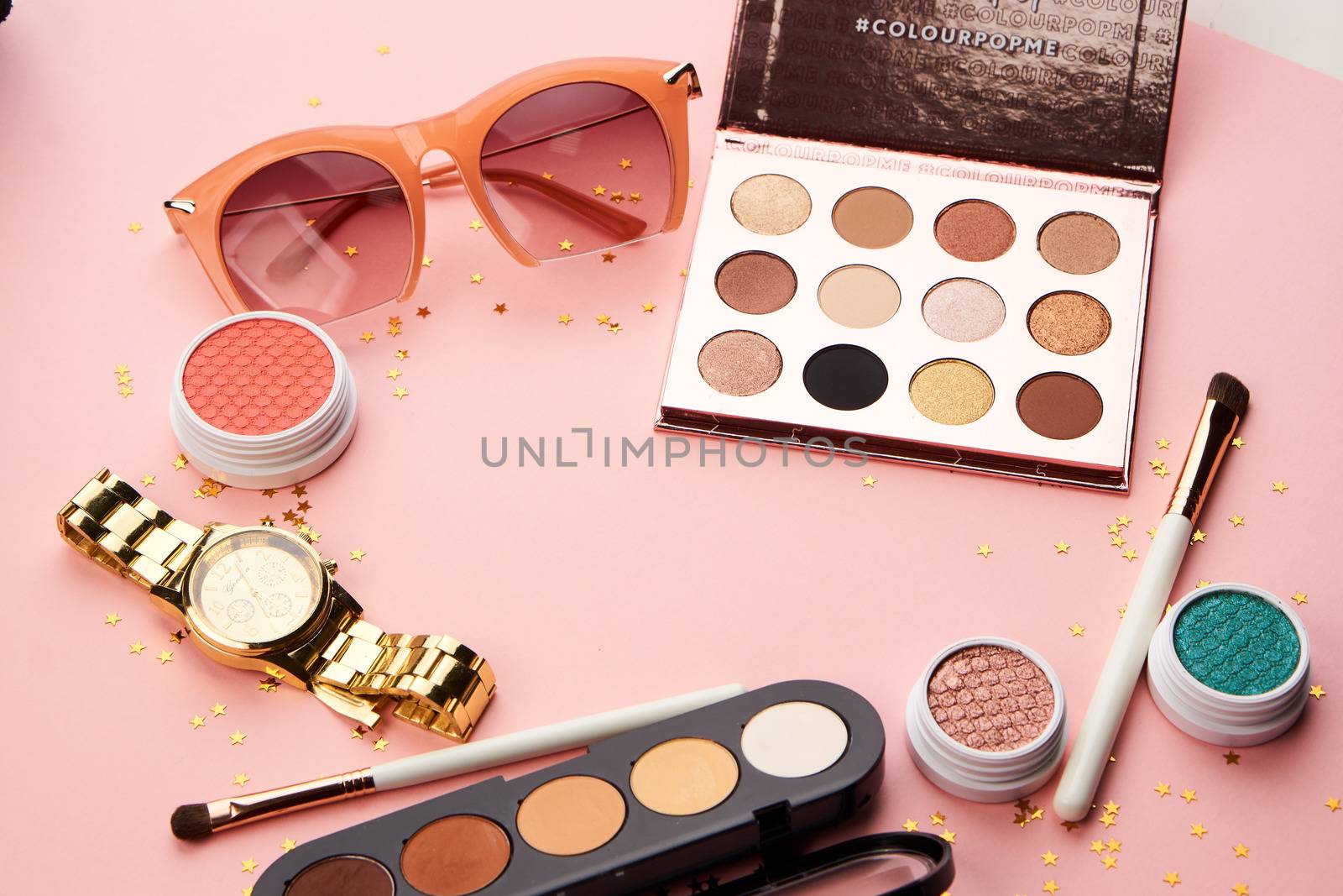 cosmetic accessories eyeshadow accessories makeup brushes merchandise collection professional cosmetics on pink background.