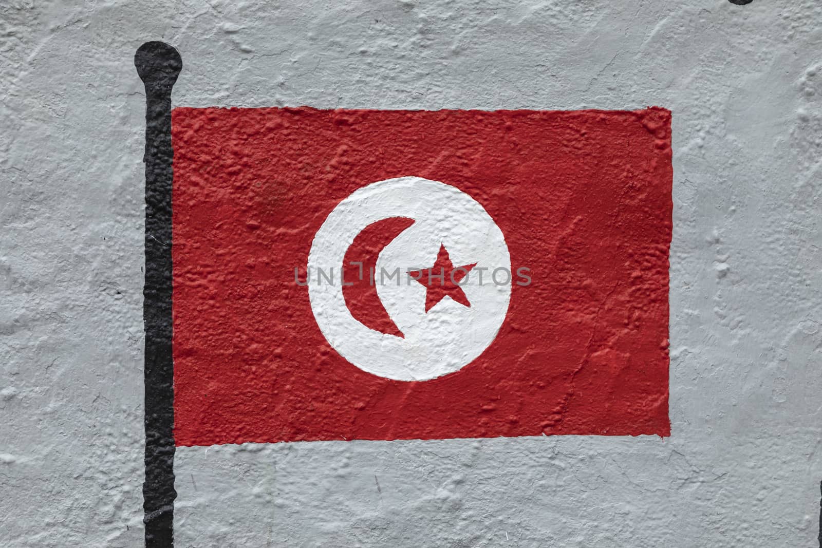 Childish style drawing, of the flag of Tunisia, painted on a wall.