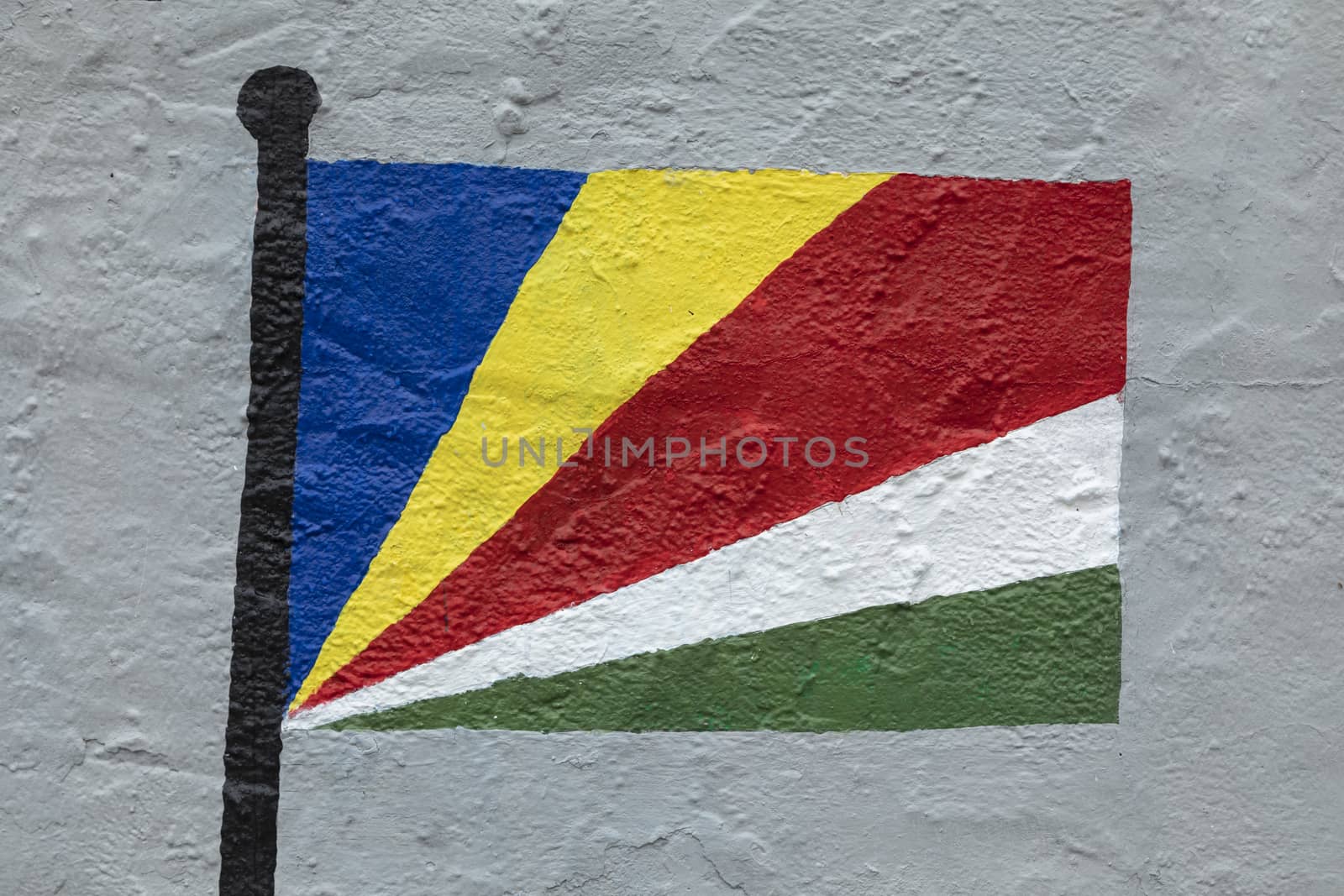 Childish style drawing, of the flag of Seychelles, painted on a wall.